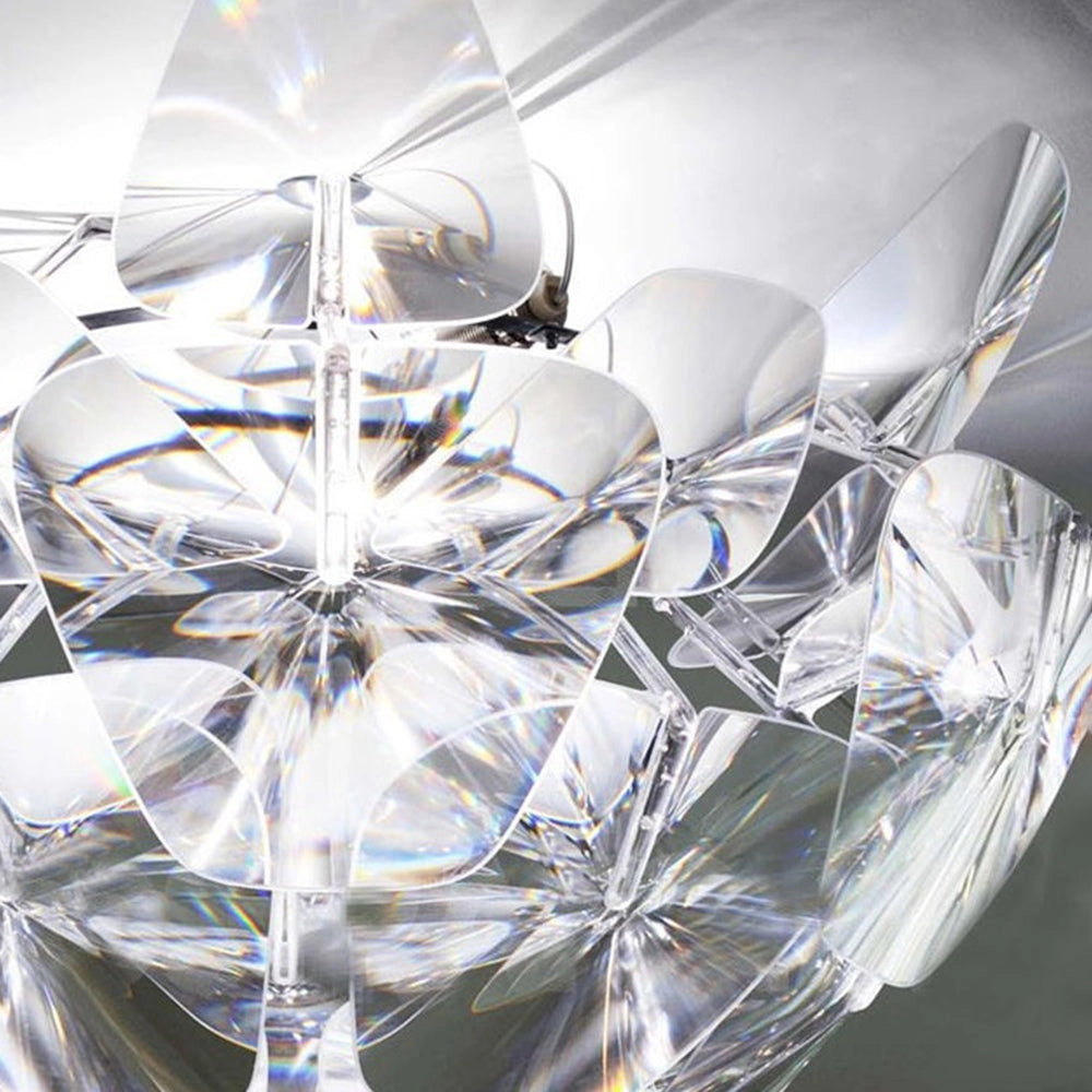 Luxury crystal pendant light featuring a modern design with elegant glass elements, showcasing a symmetrical triangular pattern in shades of white and electric blue.