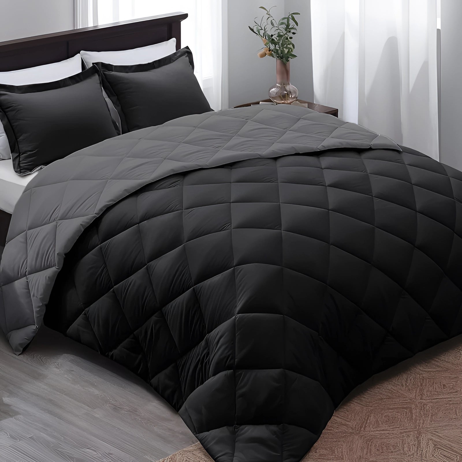Luxury dark grey hypoallergenic down alternative comforter in gray-black color, displayed on a bed with clean lines and subtle pattern, conveying a sense of comfort and elegance, dimensions 229 x 269 cm.
