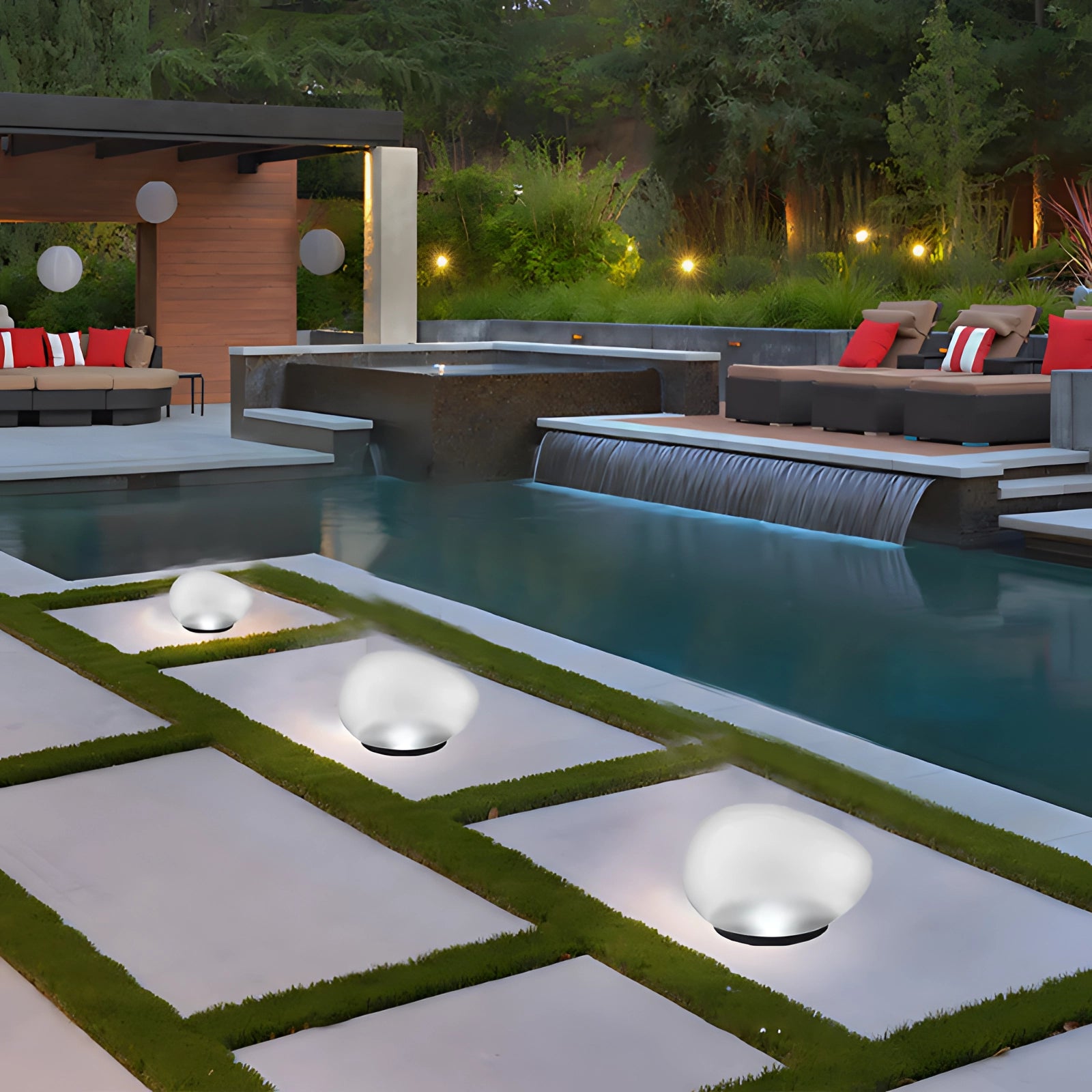 Elegant luxury floating pool lights illuminating a modern garden setting with sleek outdoor design, surrounded by lush greenery, wooden decking, and contemporary urban decor, enhancing the leisure ambiance.