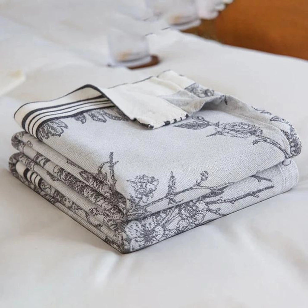 Luxurious botanical-themed floral cotton duvet cover set displayed on a bed, featuring intricate patterns and high-quality linens.