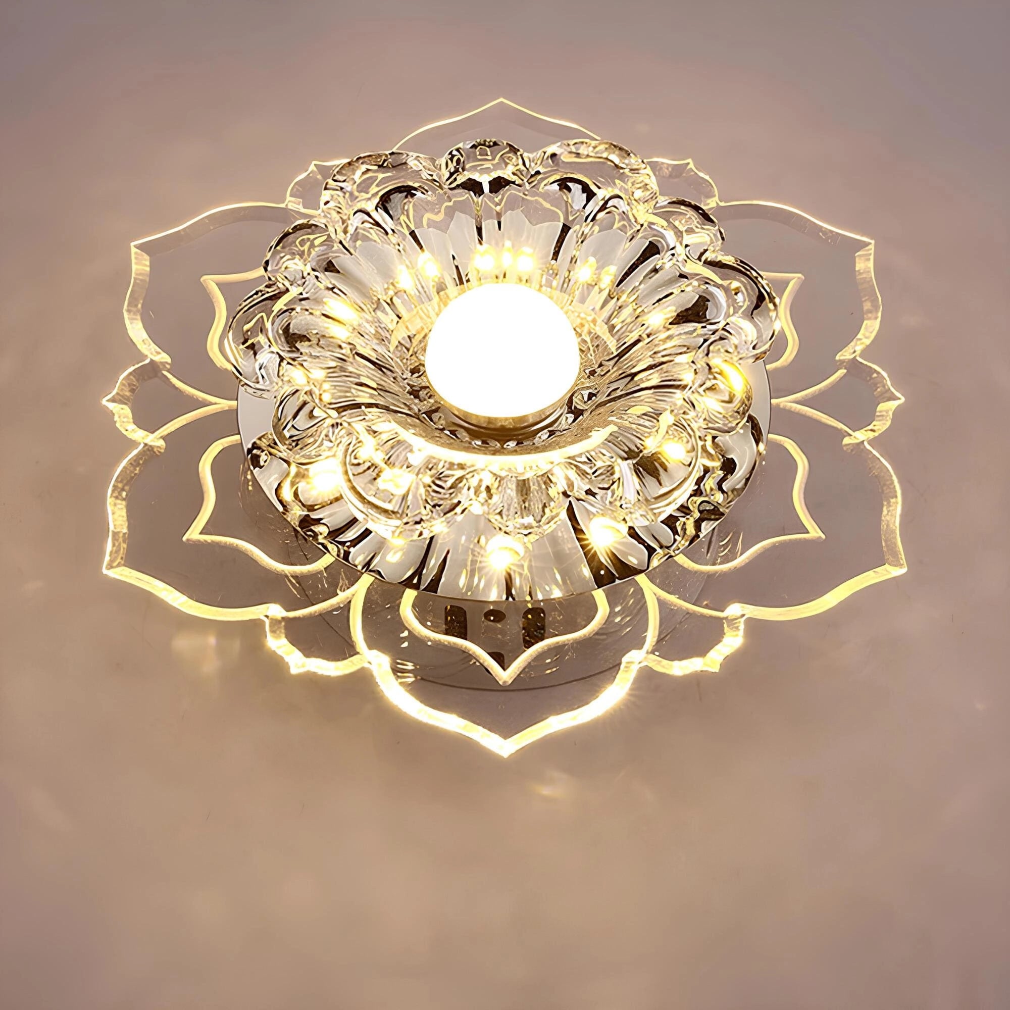 Luxurious floral designer crystal ashtray featuring a high-end decorative design with gold and amber tones, circular shape, intricate patterns, and symmetrical metal accents.