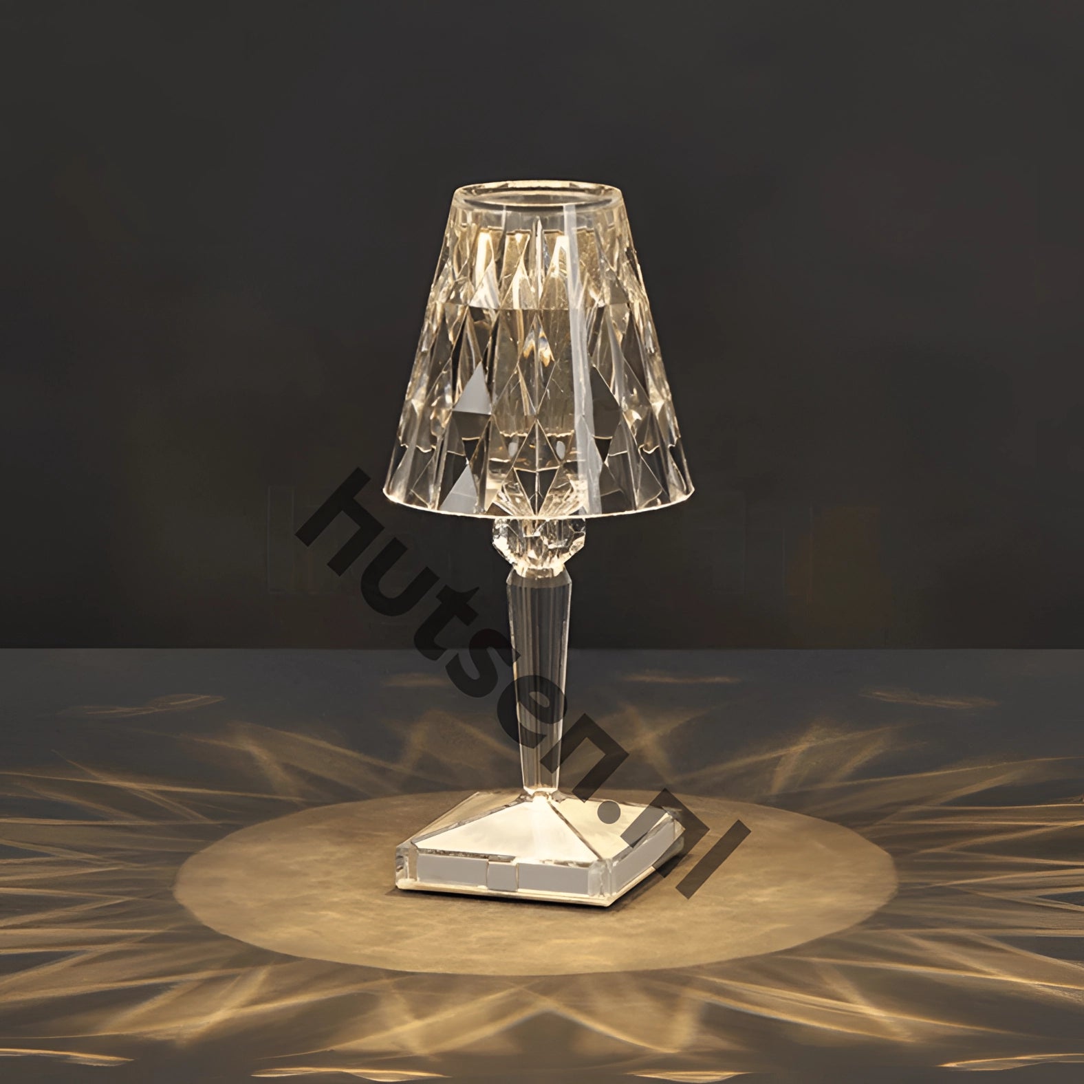 Luxury geometric crystal LED bedside lamp featuring a transparent crystal body with a sleek metal base, complemented by a modern lampshade, perfect for upscale decor and adding a touch of elegance to any room setting.