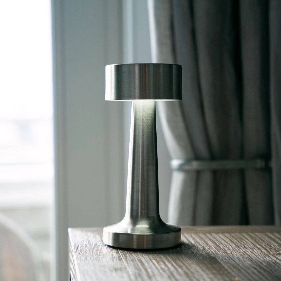 Luxury gold cordless table lamp with elegant design, featuring a rechargeable battery; perfect for dining lighting, made of metal and wood accents.