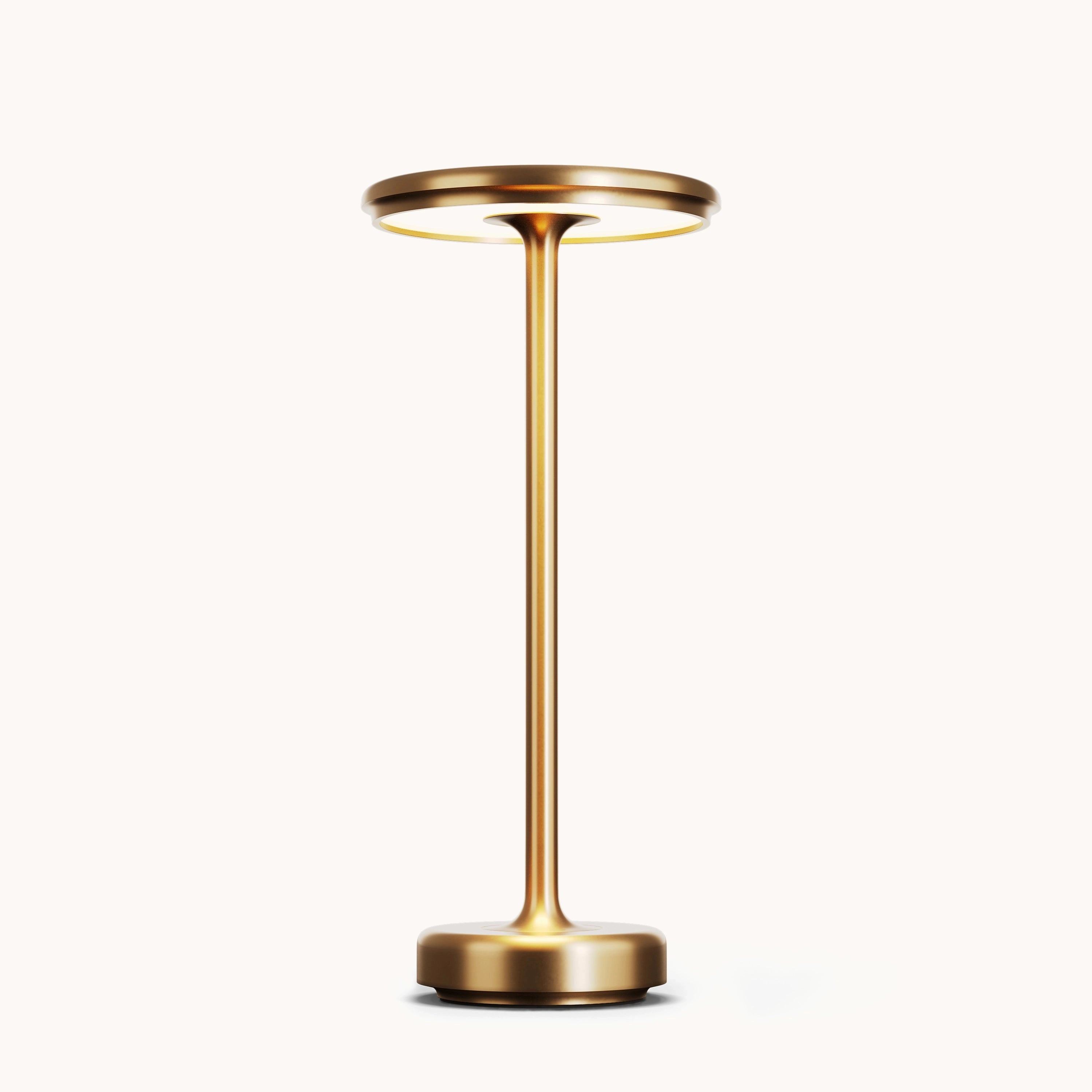 A modern minimalist gold LED floor lamp with a sleek design, featuring a circular lamp head and a rectangular base, crafted from metal.