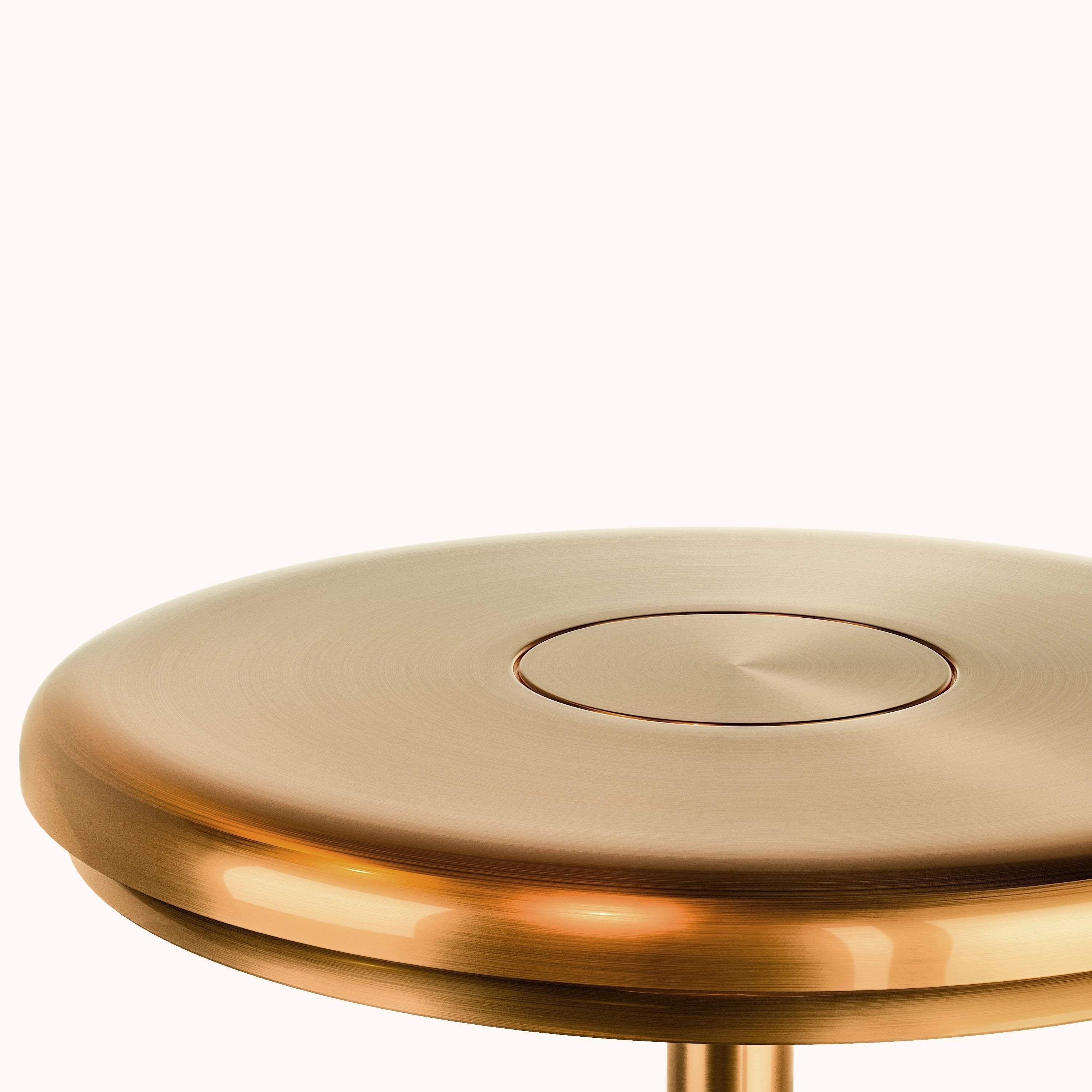 A sleek and modern luxury gold LED floor lamp with a minimalist design, featuring a slender metal frame and a circular base. The lamp is positioned in a contemporary living space with wooden flooring and a ceiling in the background.