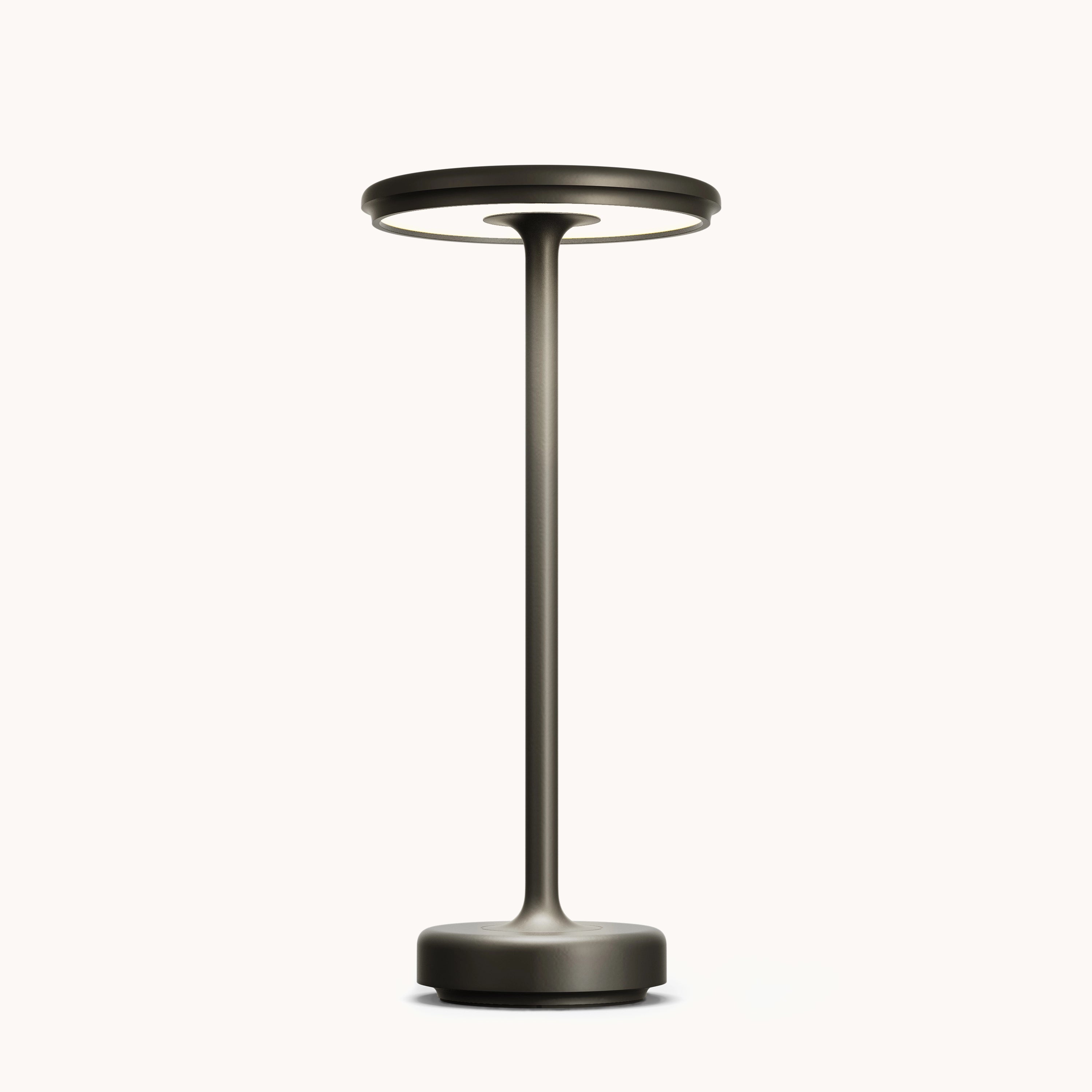 A modern minimalist luxury gold LED floor lamp with a sleek black finish, elegantly standing next to a glass vase on a small table, surrounded by minimalist decor elements.