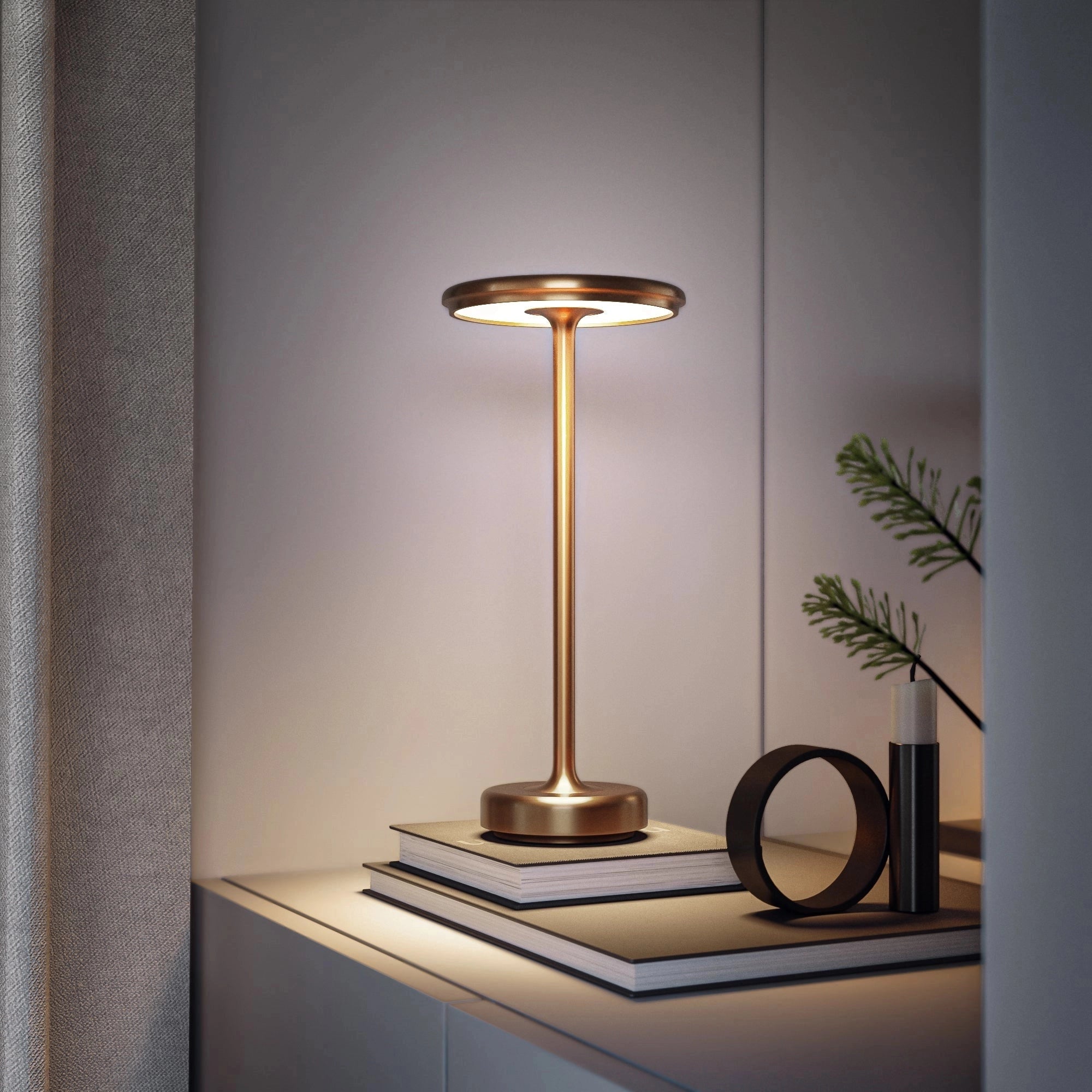 Luxurious gold LED floor lamp with a modern minimalist design, featuring a sleek and elegant structure placed in a contemporary setting with wooden flooring and decorative plants in the background.