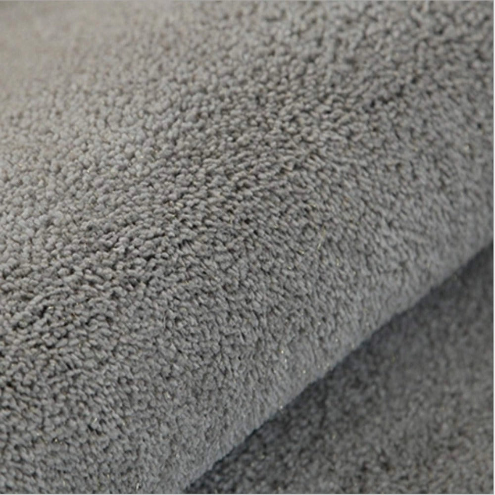Luxury grey memory foam bath mat with a plush texture, designed in a rectangular shape, featuring a non-slip backing and quick-dry material.