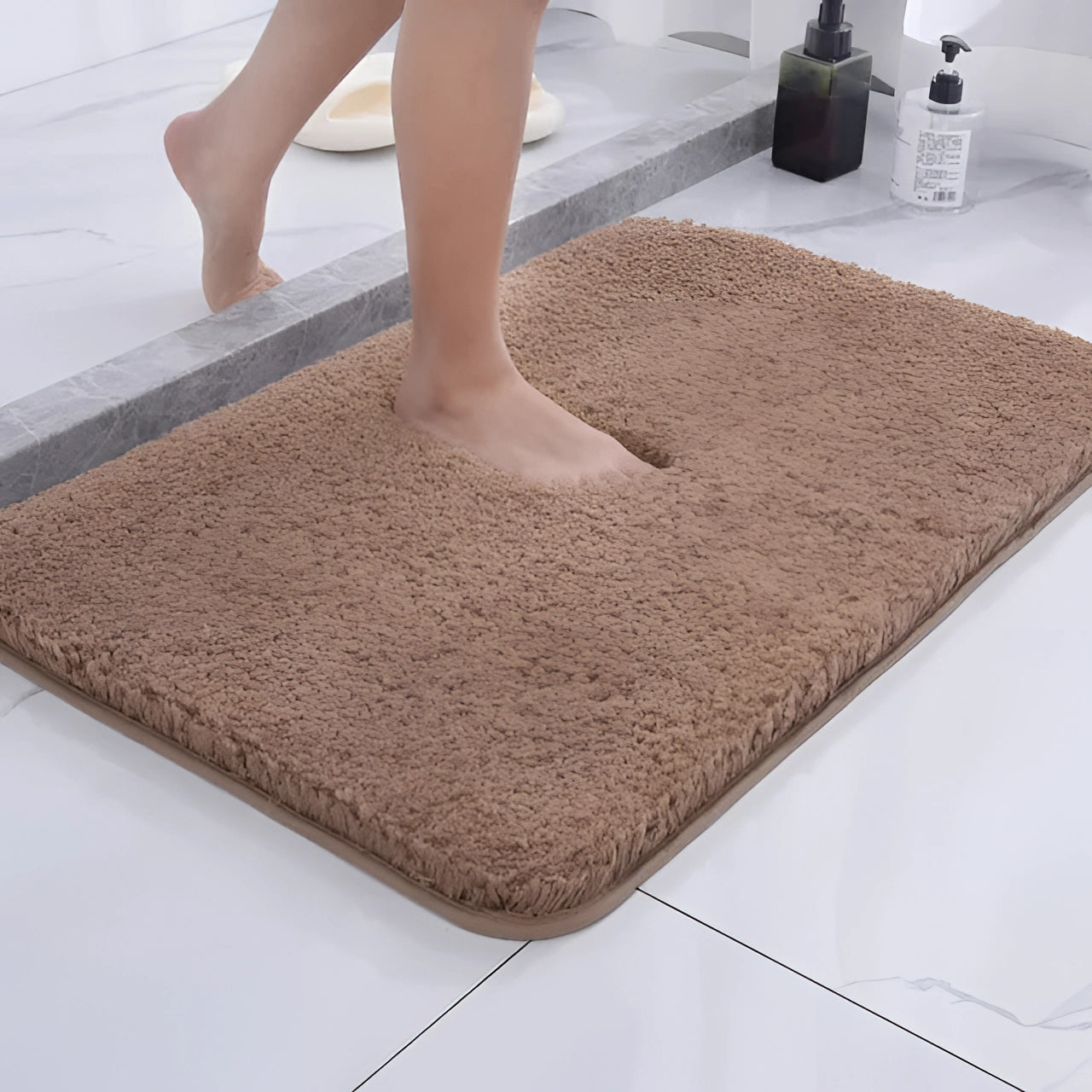 Luxurious camel-colored rectangular bath rug on a hardwood floor with non-slip backing, designed for quick drying and comfort.
