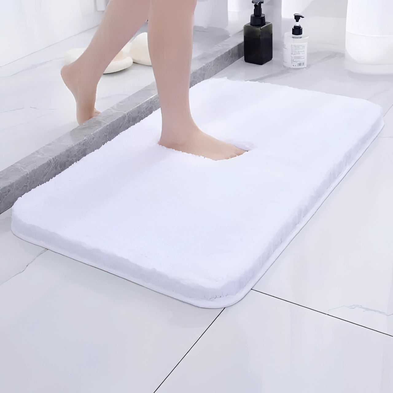 
A large white luxury plush bath rug with a rectangular shape placed on a wooden floor, designed for comfort with non-slip and quick-dry properties.