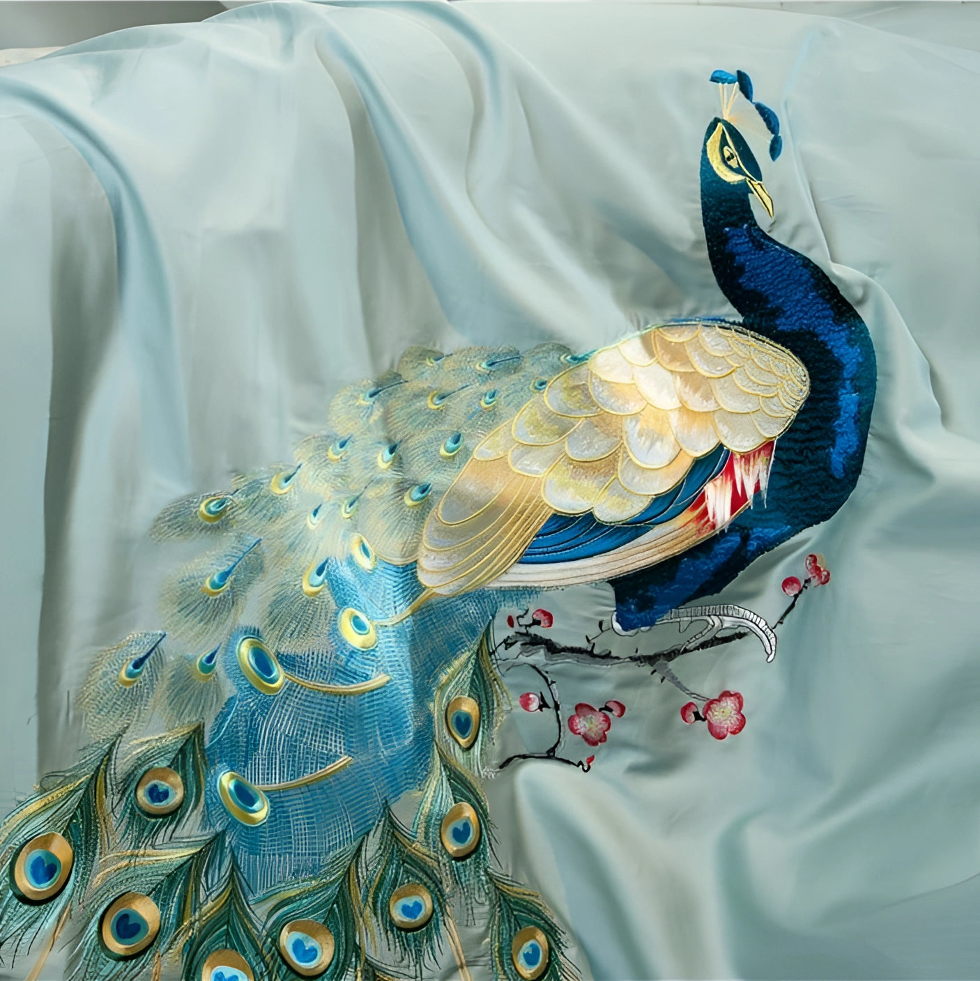 Luxurious teal and gold embroidered duvet cover featuring a peacock feather design with vibrant azure and aqua accents.