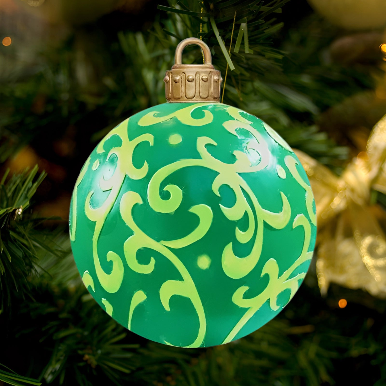 Luxury red plaid tartan glass Christmas ornament hanging on an evergreen Christmas tree branch, surrounded by festive holiday decorations.