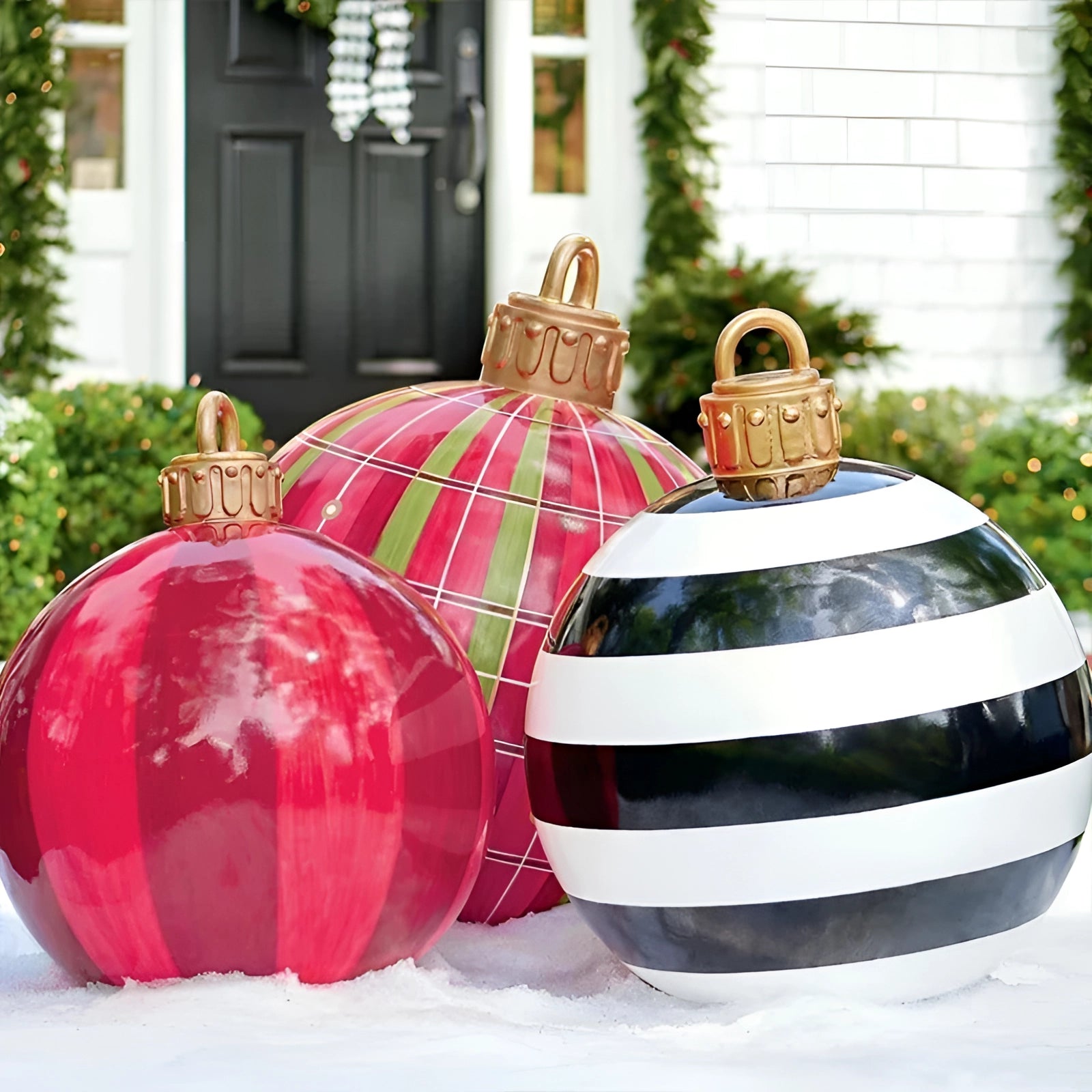 Luxury red plaid tartan glass Christmas ornament hanging near a window, featuring intricate plaid design and vibrant red hues.