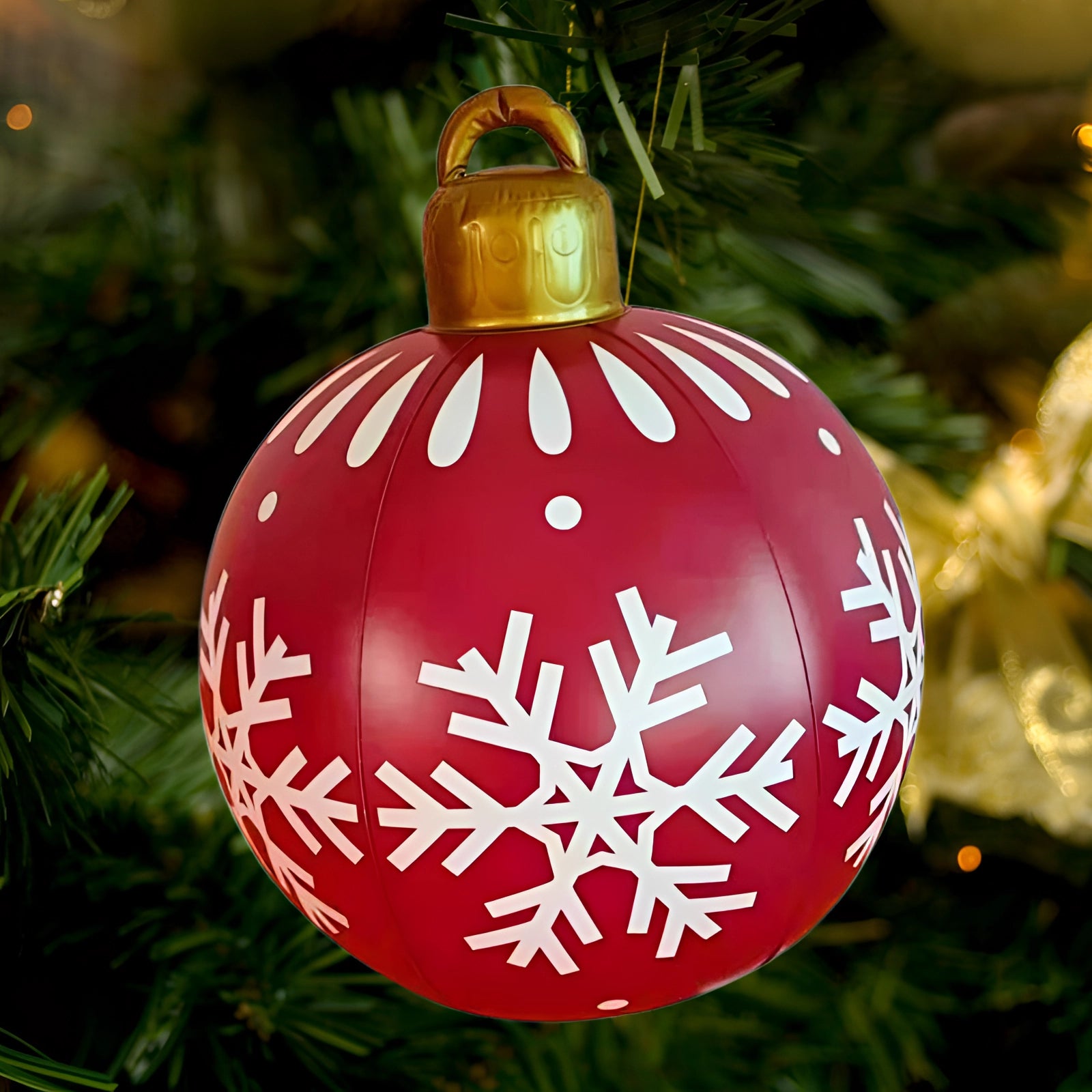 Luxury red plaid tartan glass Christmas ornament hanging on a decorated evergreen tree, illuminated by festive lights, adding elegance to the holiday decor.