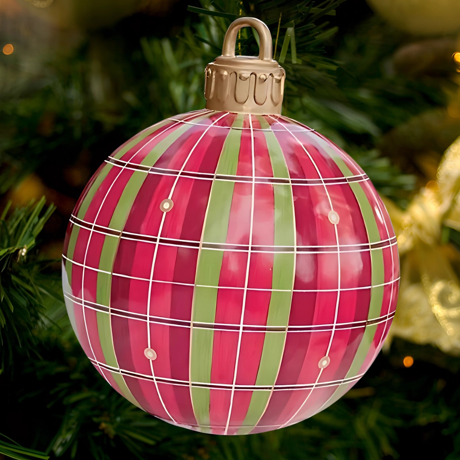 Luxury red plaid tartan glass Christmas ornament hanging on an evergreen tree, featuring intricate plaid patterns and vibrant red hues, ideal for holiday decor.