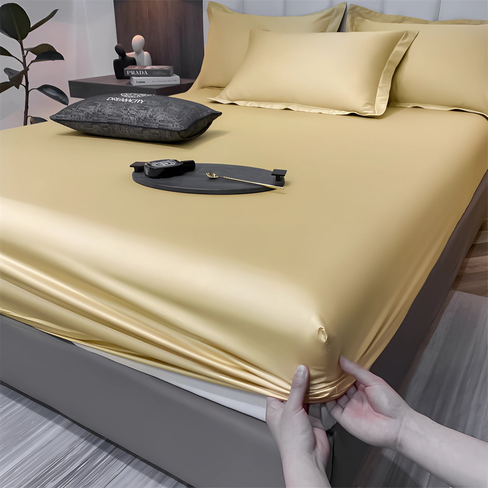 Luxury red silk satin bedsheet set displayed on a neatly made bed with deep pocket design, enhancing the luxurious and wrinkle-free appearance.