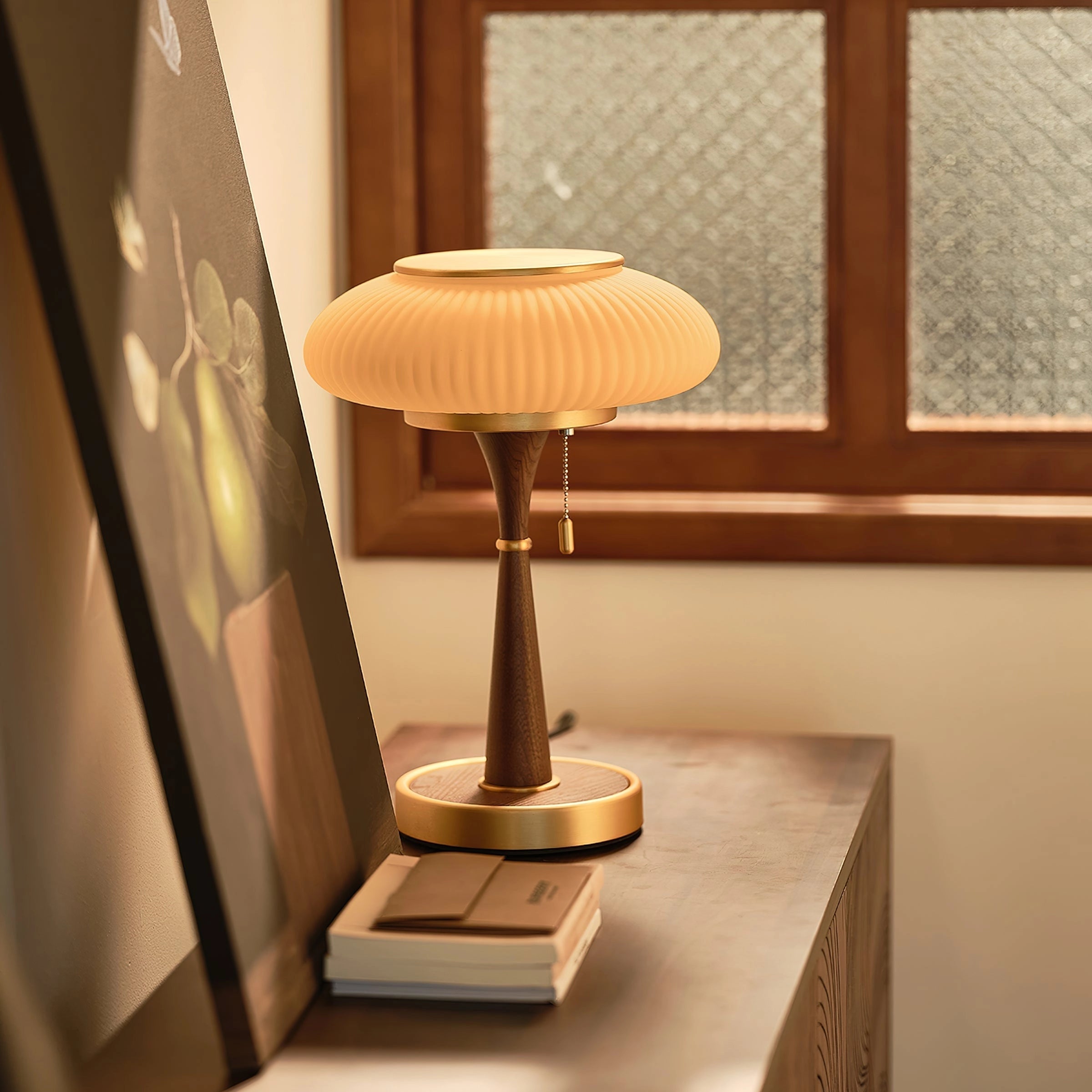 Luxury vintage table lamp featuring a ribbed glass body with a gold finish, positioned on a wooden floor in an elegantly designed interior space. The lampshade complements the lamp's opulent aesthetic.