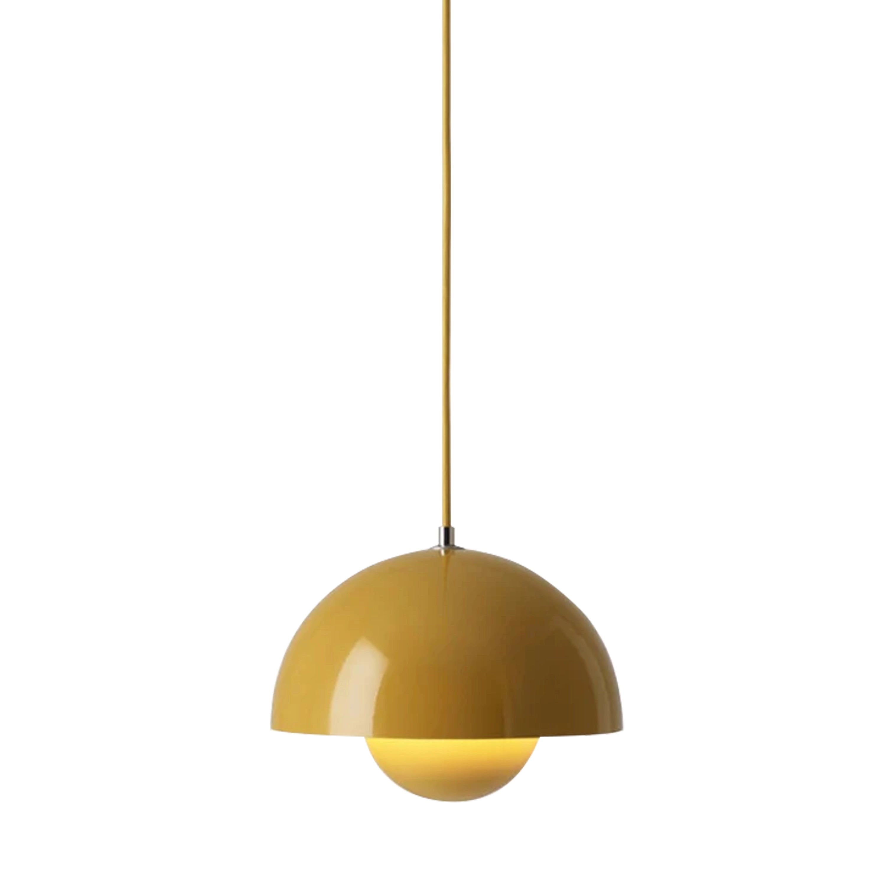Modern minimalist matte black dome pendant light with a spherical design, featuring a yellow interior, hanging from the ceiling above a table.