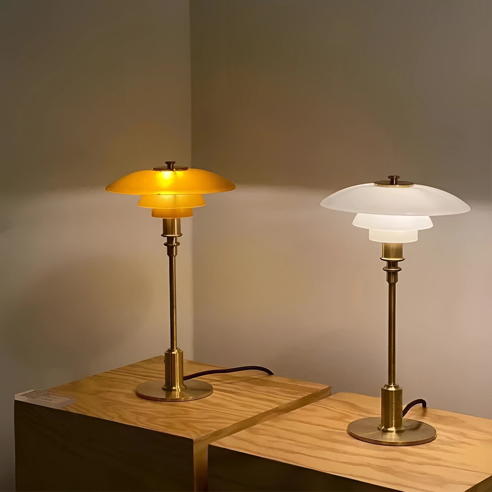 Mid-Century Modern Adjustable Brass Table Lamp with Orange Glass Shade, featuring Danish Design elements, placed on a wooden table.
