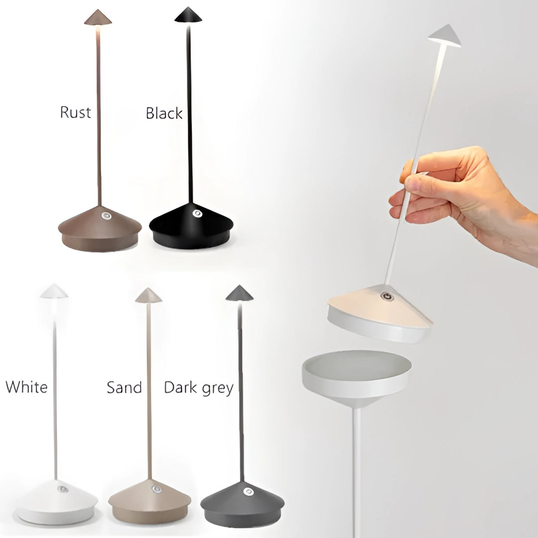 Minimalist arrow-shaped LED desk lamp with a sleek white design, emitting a soft light, positioned on a modern shelving unit in a contemporary room setting.