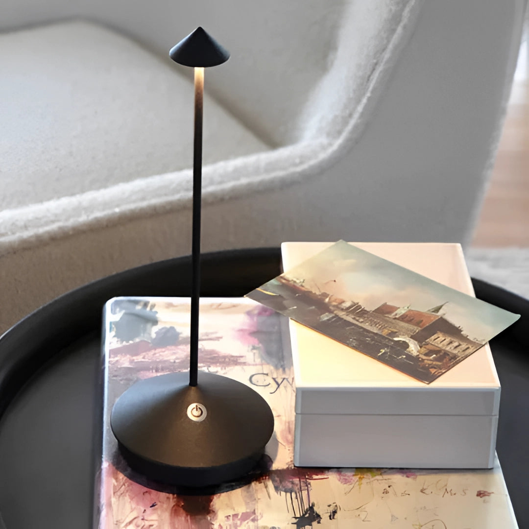 Minimalist arrow-shaped LED desk lamp in a sleek white design, featuring a modern aesthetic with clean lines and geometric shapes, perfect for contemporary decor settings.