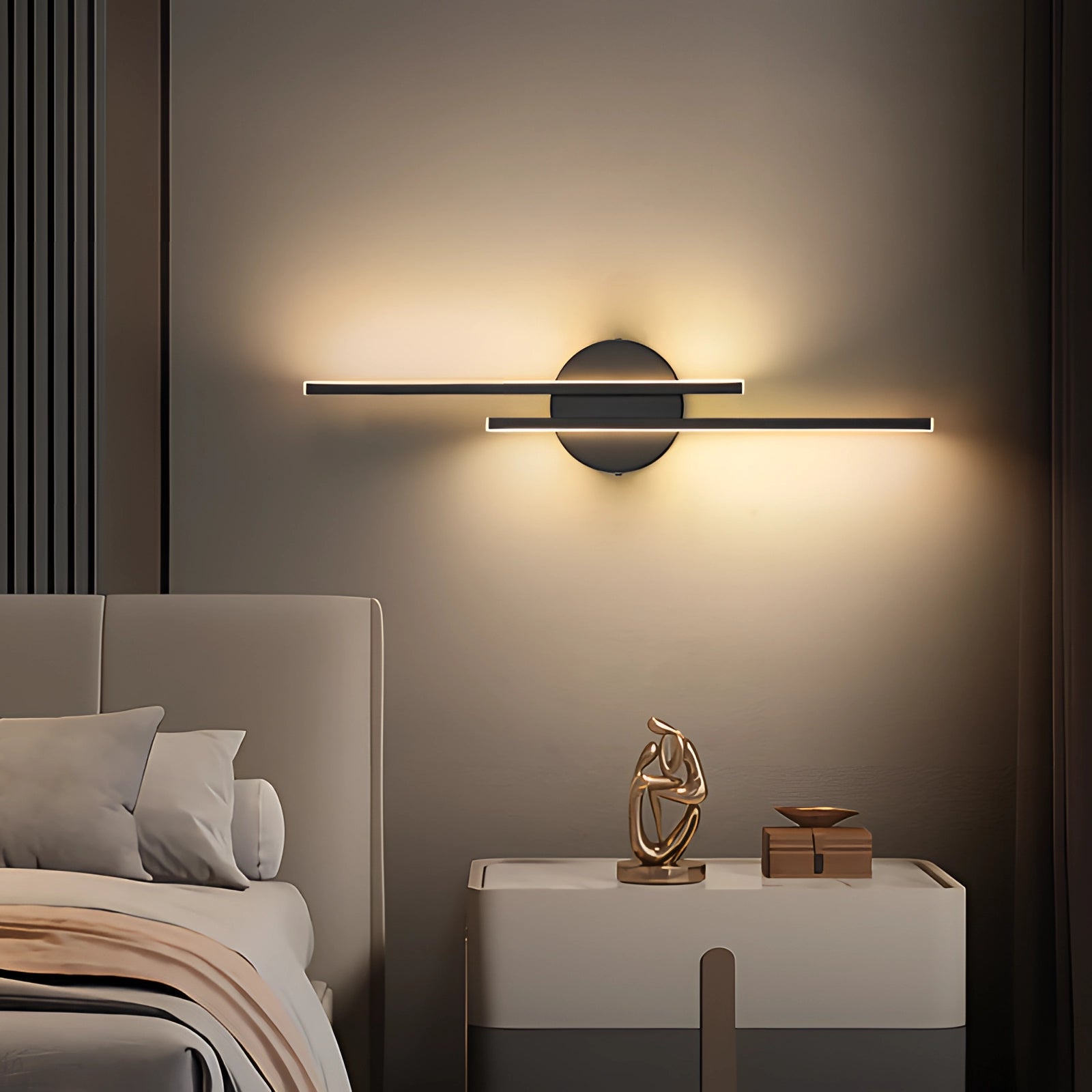Minimalist black LED wall sconce with a modern vertical metal design, emitting cold light, mounted on a white wall above a wooden shelf, enhancing the interior design with a sleek and comfortable lighting solution.