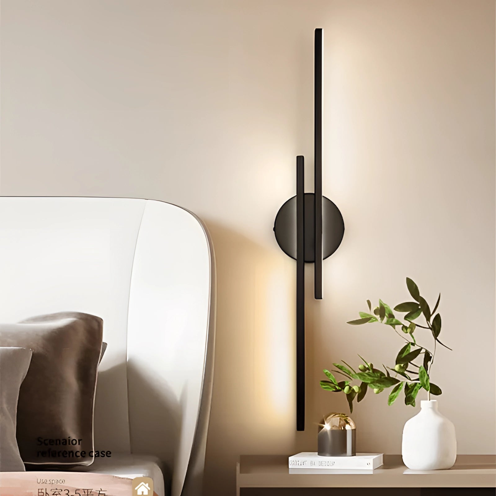 Minimalist black LED wall sconce in a modern vertical design, mounted on a wall, emitting warm light. Surrounded by houseplants, it complements the interior design with its sleek rectangular metal structure.