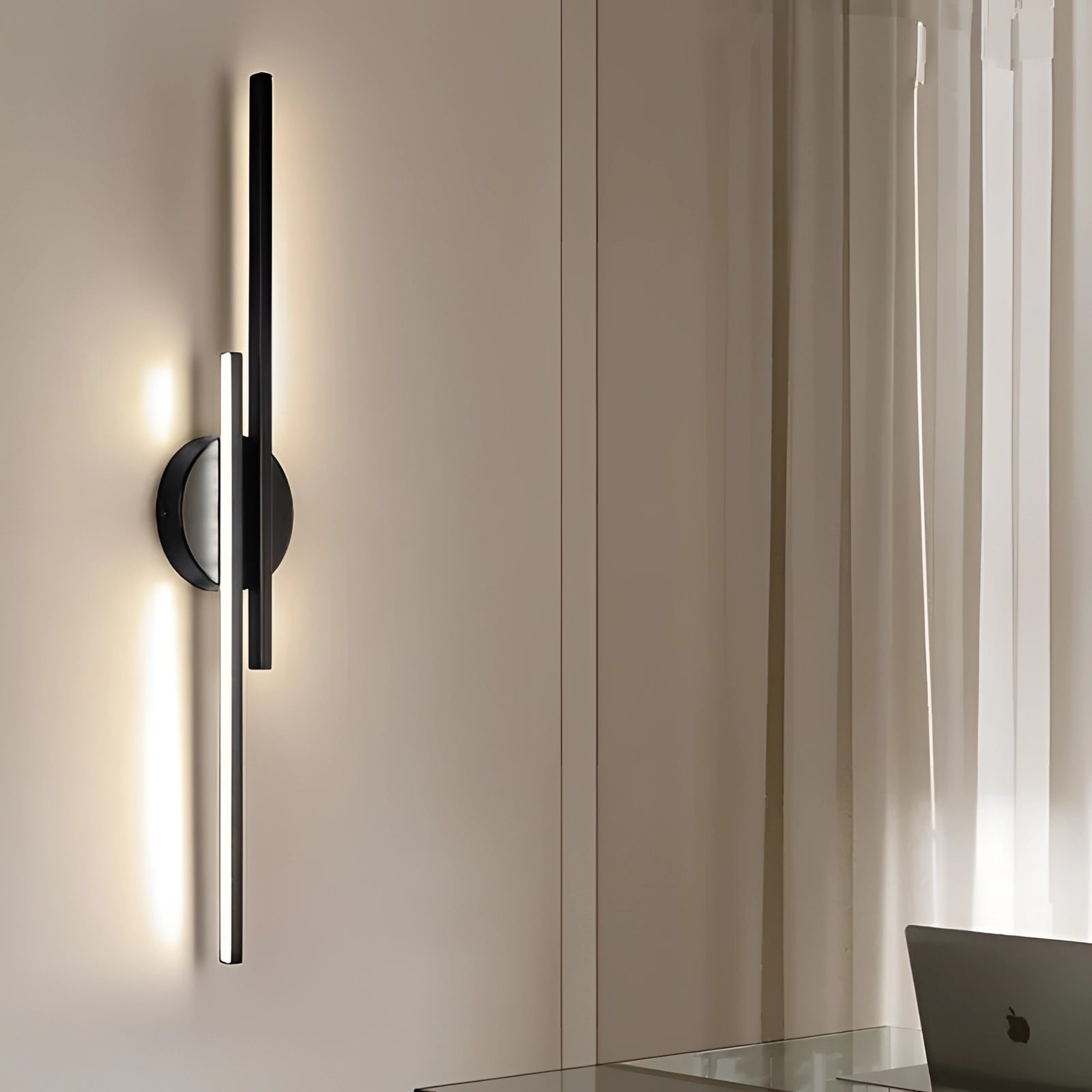 Minimalist black LED wall sconce in a modern vertical design, featuring a sleek metal fixture.