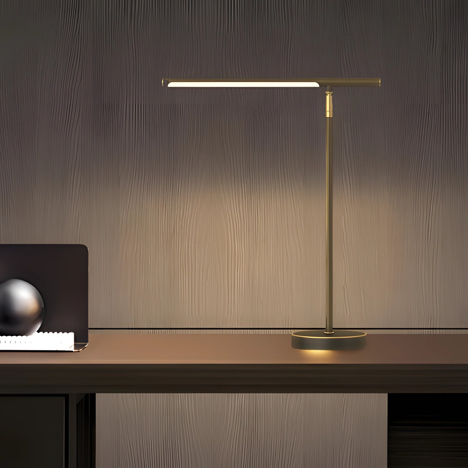 
Black minimalist gold LED desk lamp with adjustable arm, placed on a wooden shelf with plywood flooring visible in the background.