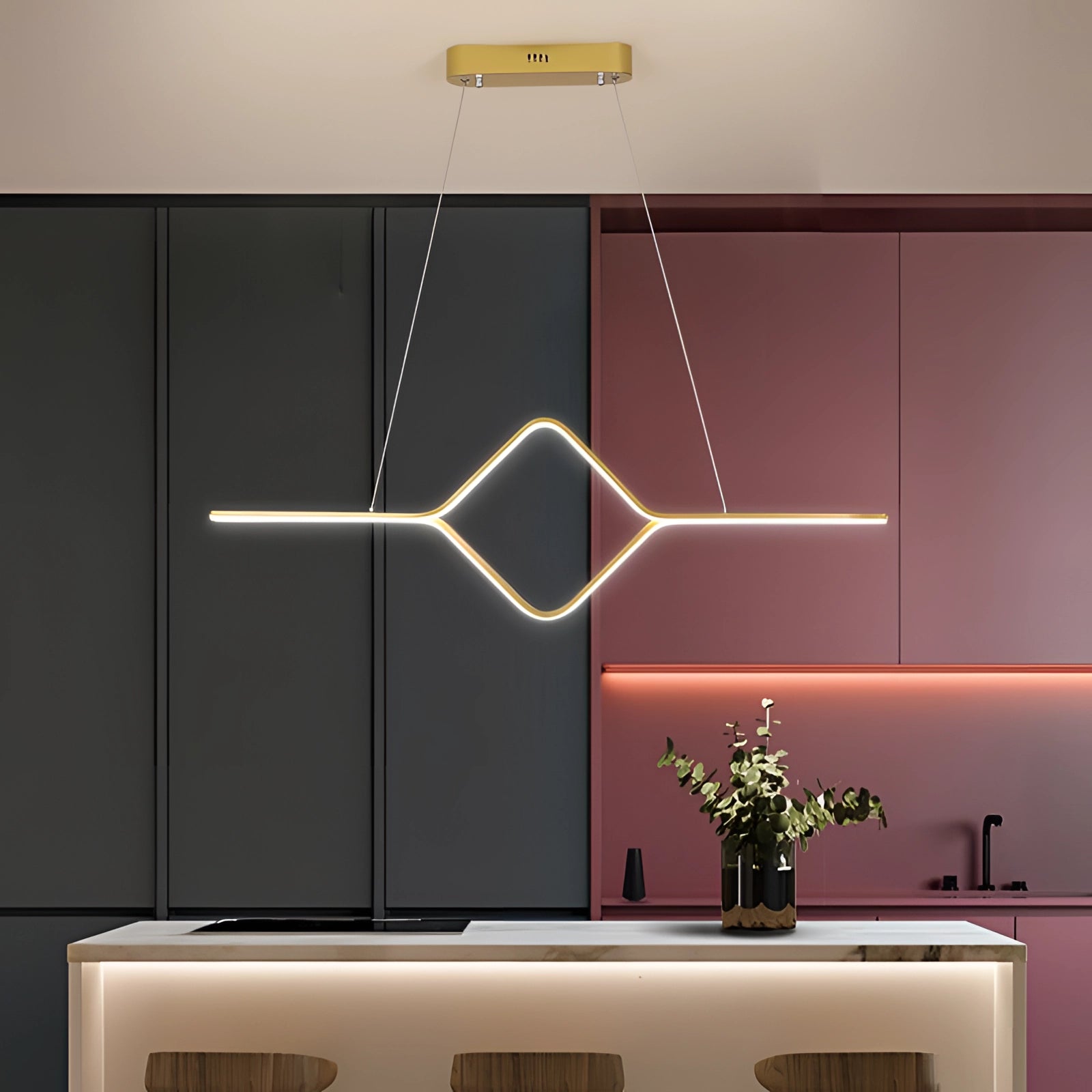 Minimalist gold LED geometric pendant light fixture with a cold white glow, hanging above a modern interior space featuring a small houseplant in a flowerpot.