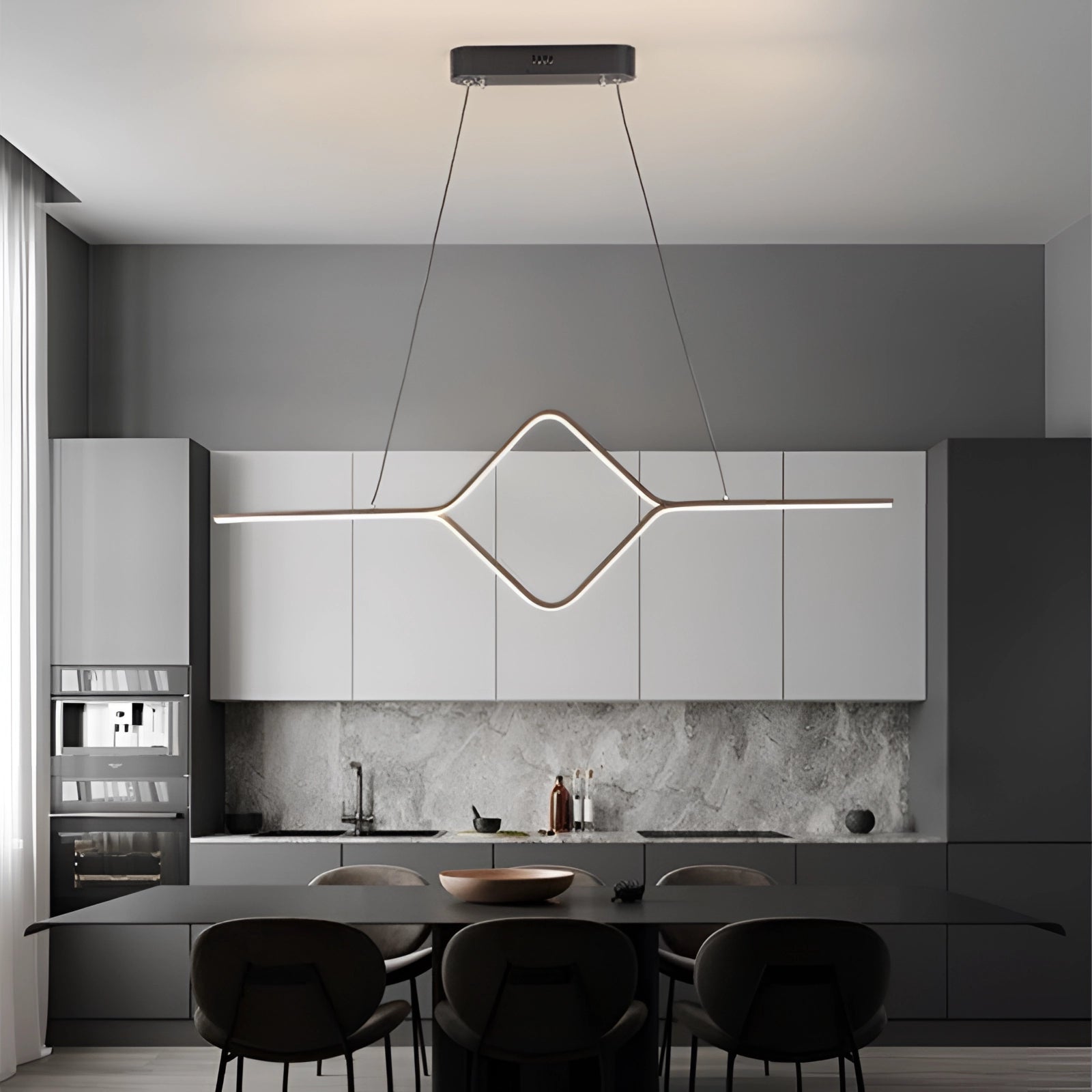 Minimalist gold LED geometric pendant light fixture in black with cold white light, hanging in a modern interior with sleek wood and grey elements.