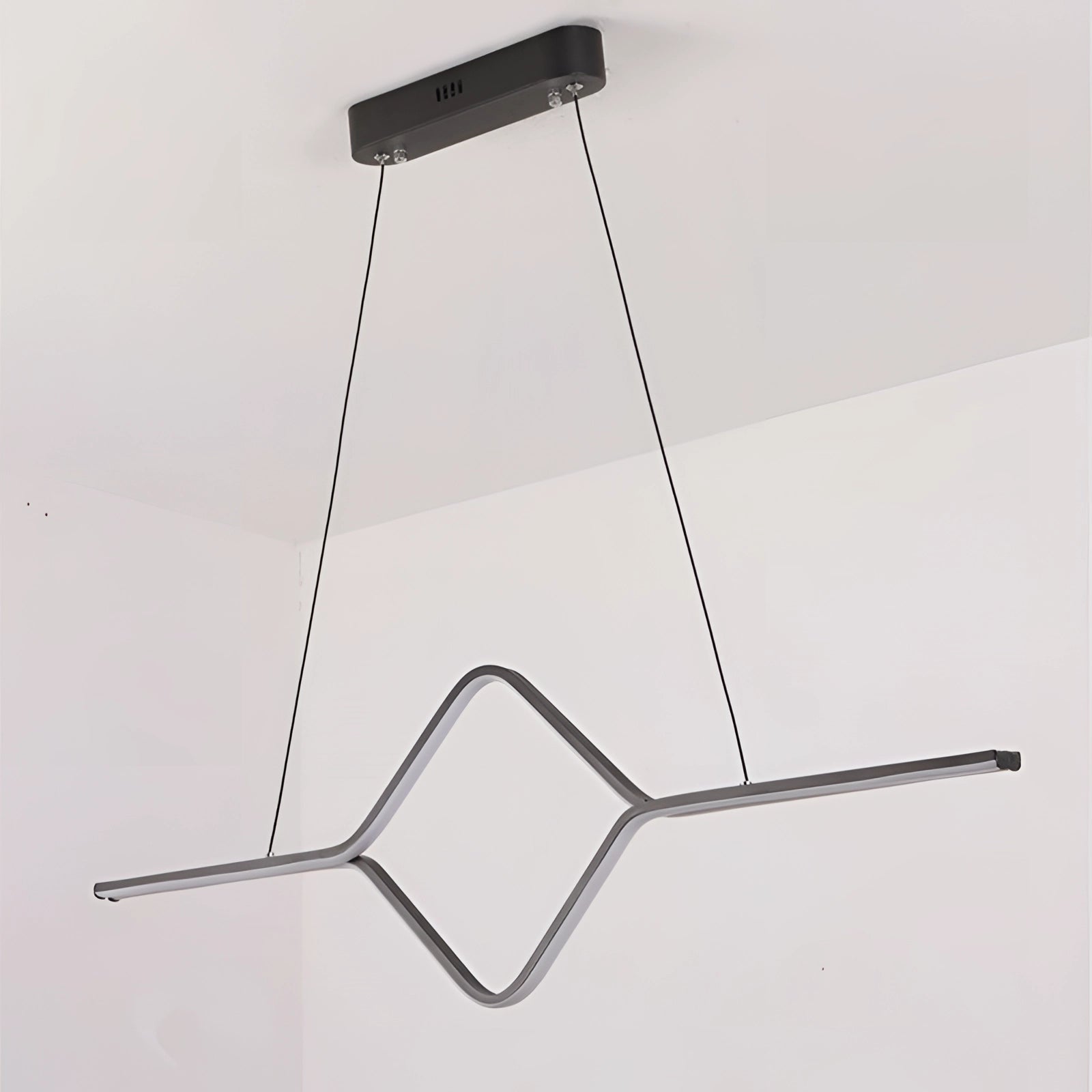 Minimalist gold geometric pendant light fixture with LED design, featuring triangular and rectangular shapes, suspended from a ceiling. Made of metal with an elegant and modern style.
