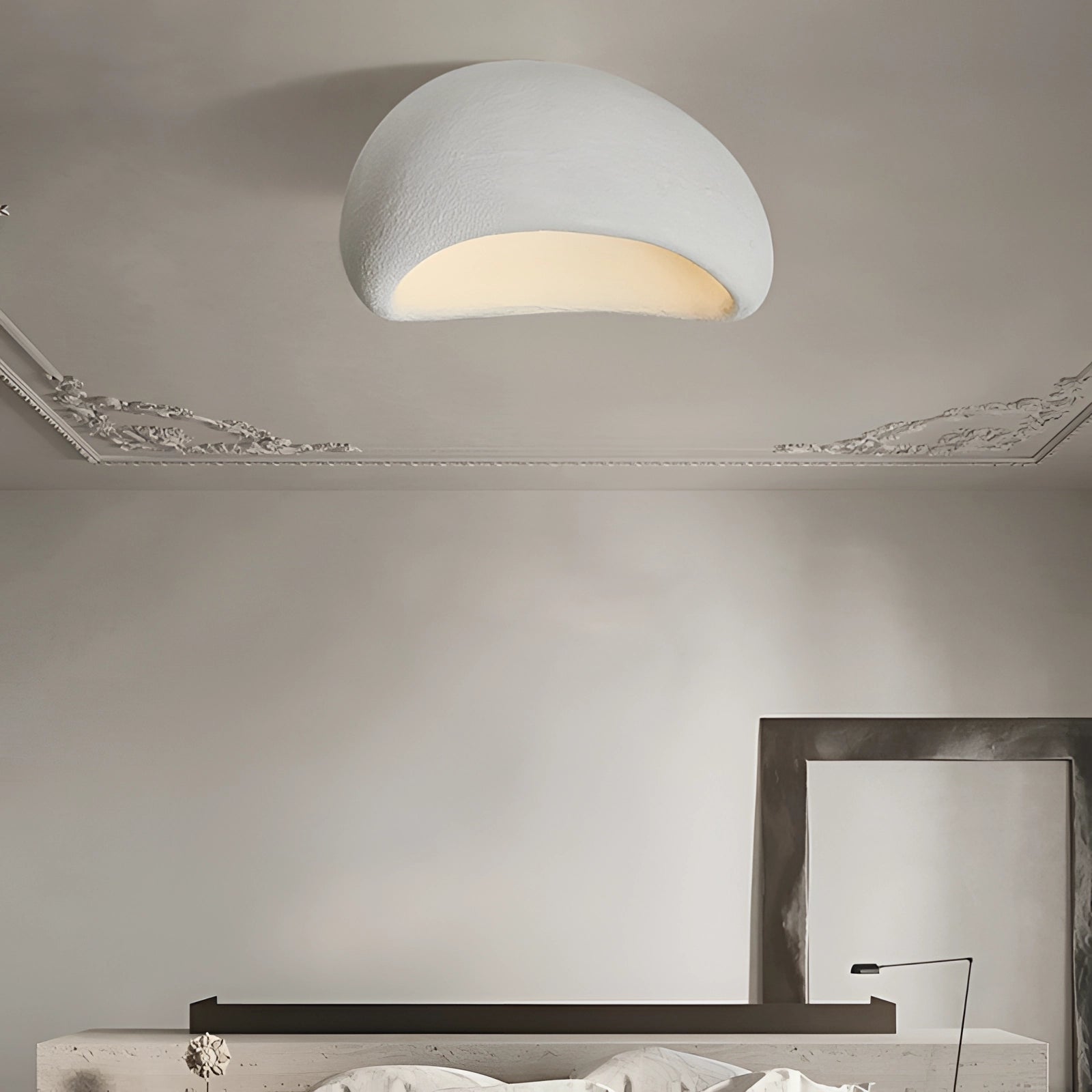 Minimalist half-moon wall sconce in white, measuring 18 inches, with standard ambient interior lighting design, mounted on a wall with a simple and sleek aesthetic.