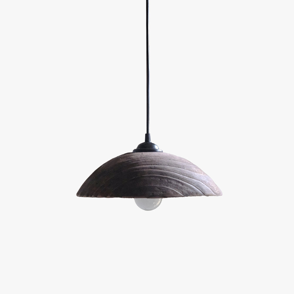 Minimalist industrial LED pendant light with a modern textured design, hanging from the ceiling.
