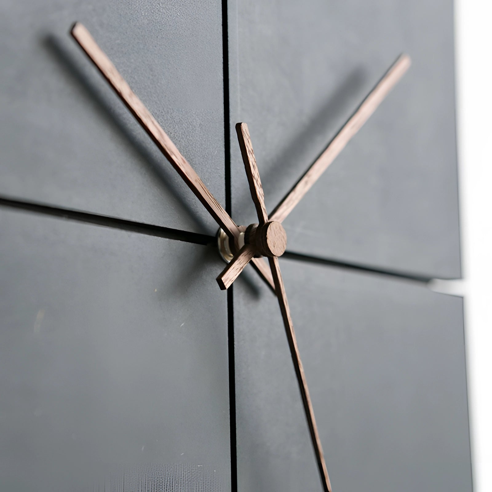 Minimalist large black square wall clock with a contemporary split design, featuring gray accents and a symmetrical layout.