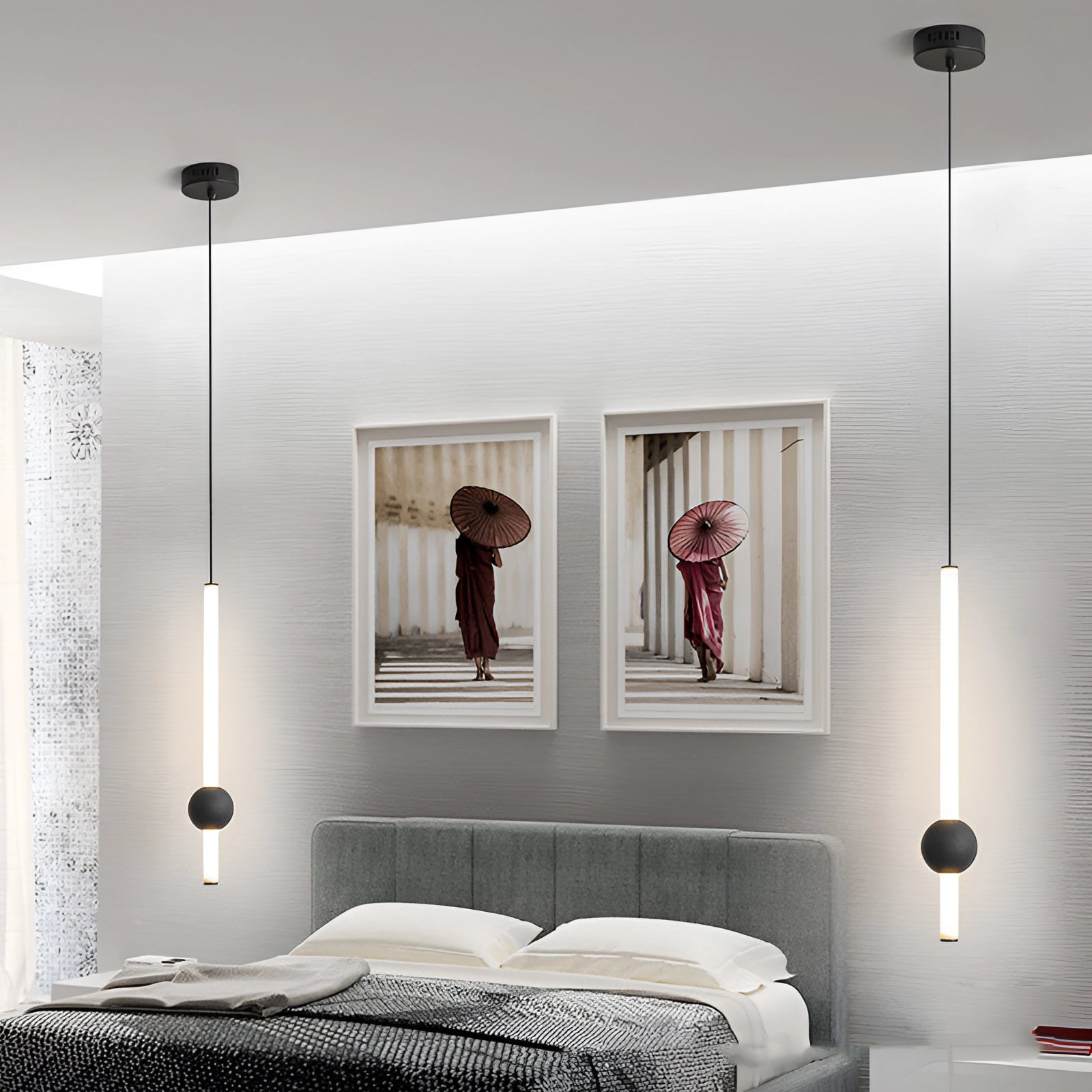 Minimalist LED pendant light featuring a black and white cylindrical globe design, hanging in a modern interior setting with wood accents and grey tones.