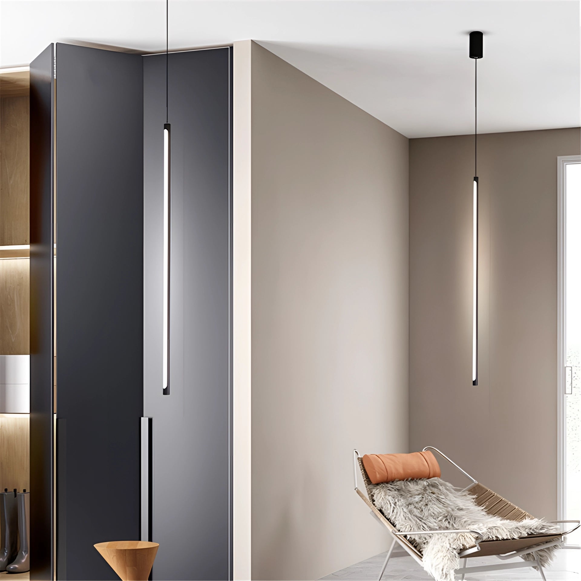 A modern minimalist LED pendant light with a rectangular wooden frame, illuminating a contemporary dining and kitchen island area with white and wood accents.