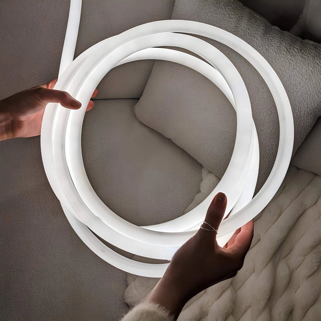 Sleek minimalist LED wall light with a wave pattern design, showcasing adjustable brightness features.