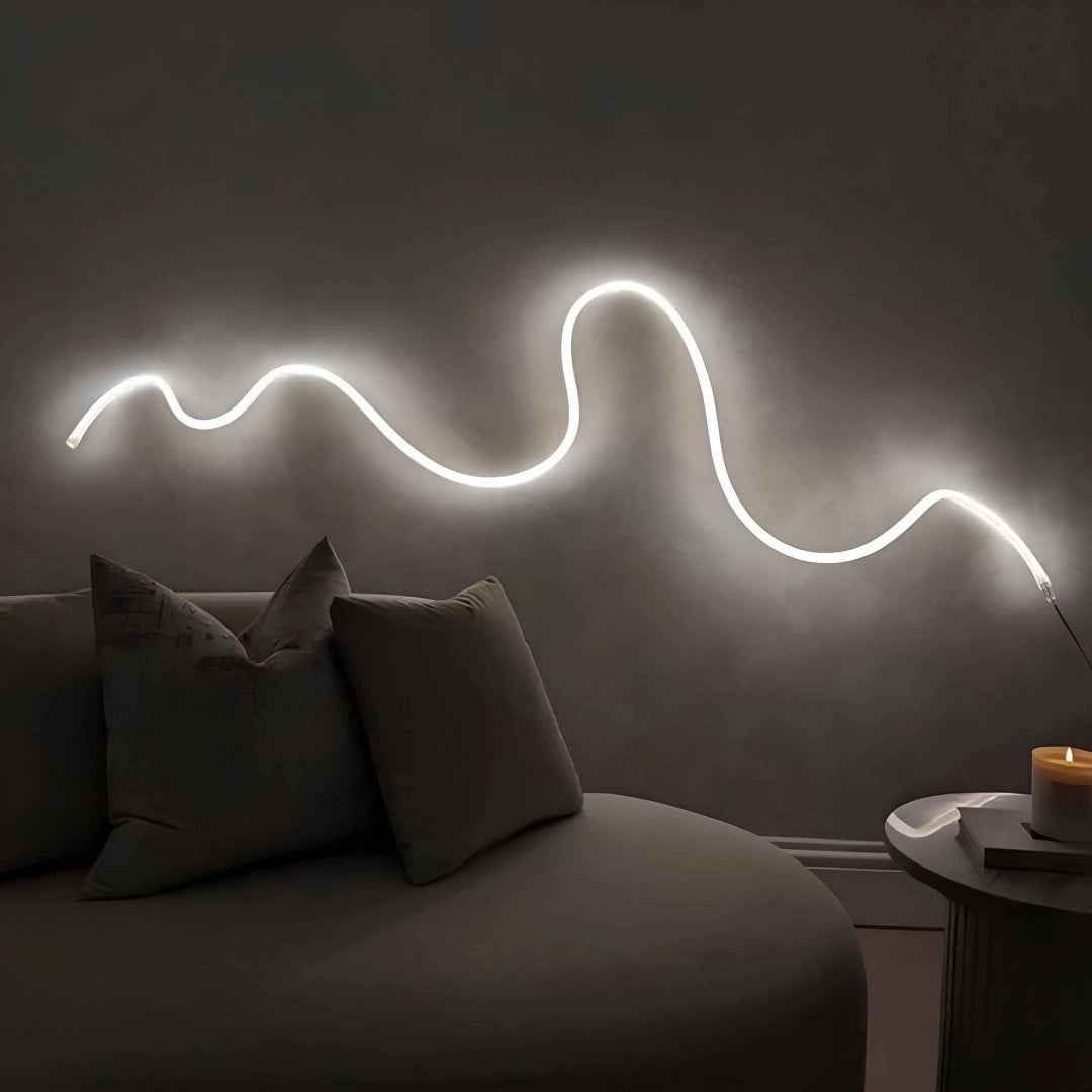 Minimalist LED wall light with a wave pattern design, featuring adjustable brightness, mounted on a grey and black wall background, suitable for modern interior design.