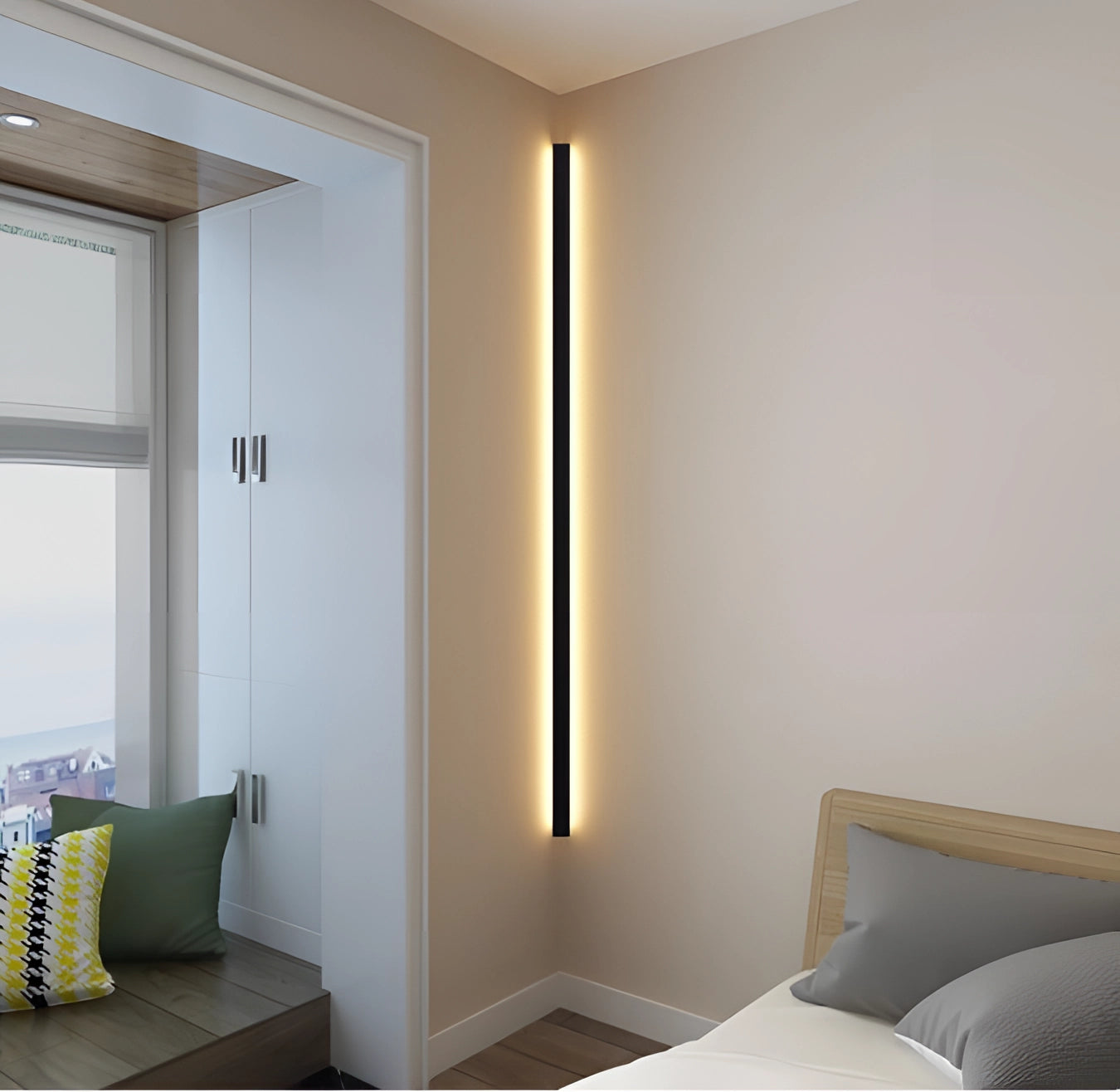 Minimalist LED wall sconce with a sleek vertical design, featuring a modern light fixture mounted on a wall in an interior setting.