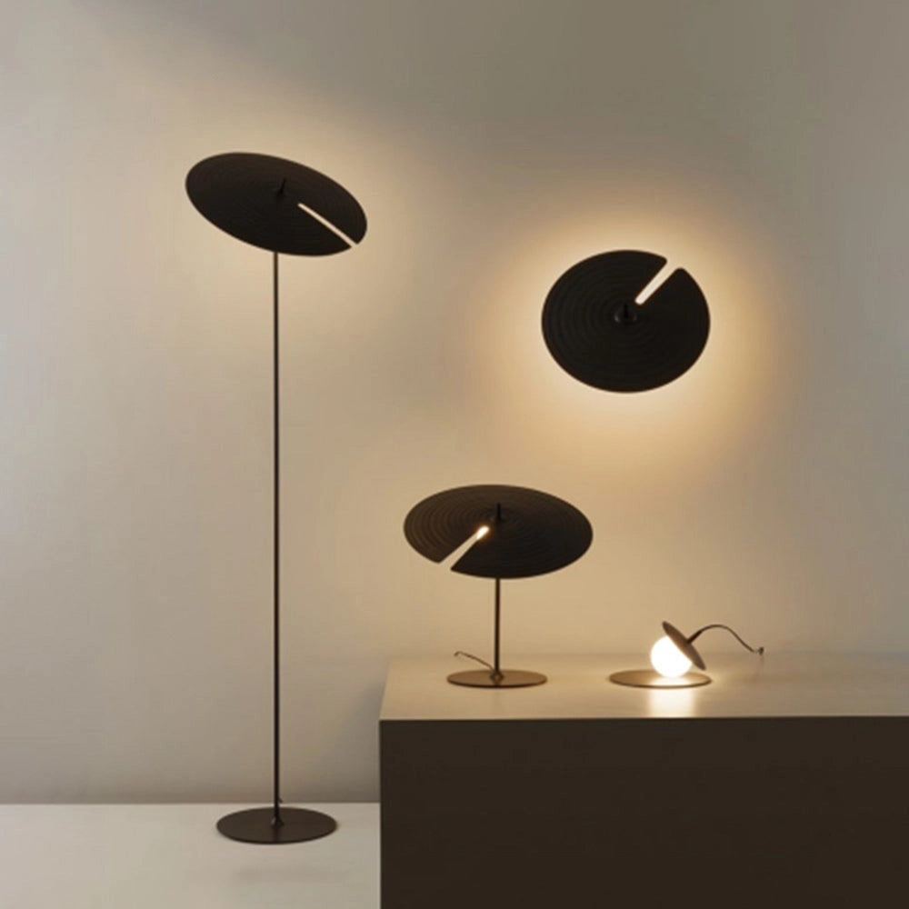 Minimalist matte black floor lamp with adjustable lighting featuring a sleek design, cylindrical lampshade, and a sturdy base, perfect for modern home decor.