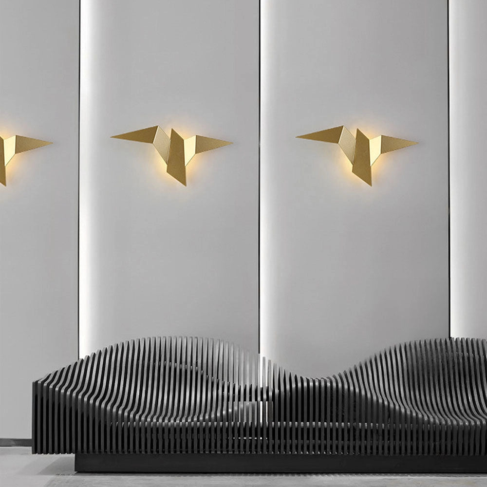 Minimalist origami bird LED wall lamp with a geometric modern design featuring a white, rectangular shape mounted on wood, suitable as an artful and functional wall decor piece.
