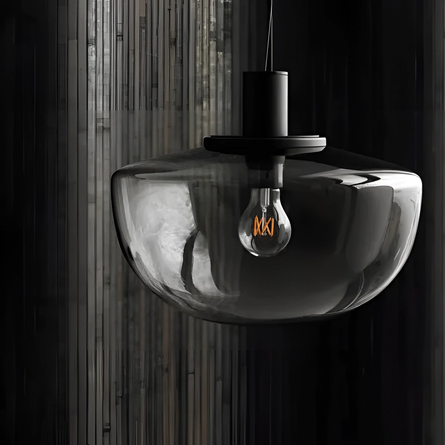 Minimalist pendant light with a modern Scandinavian design, featuring a wooden and metal cylindrical fixture, casting a warm glow suitable for a dining room setting.