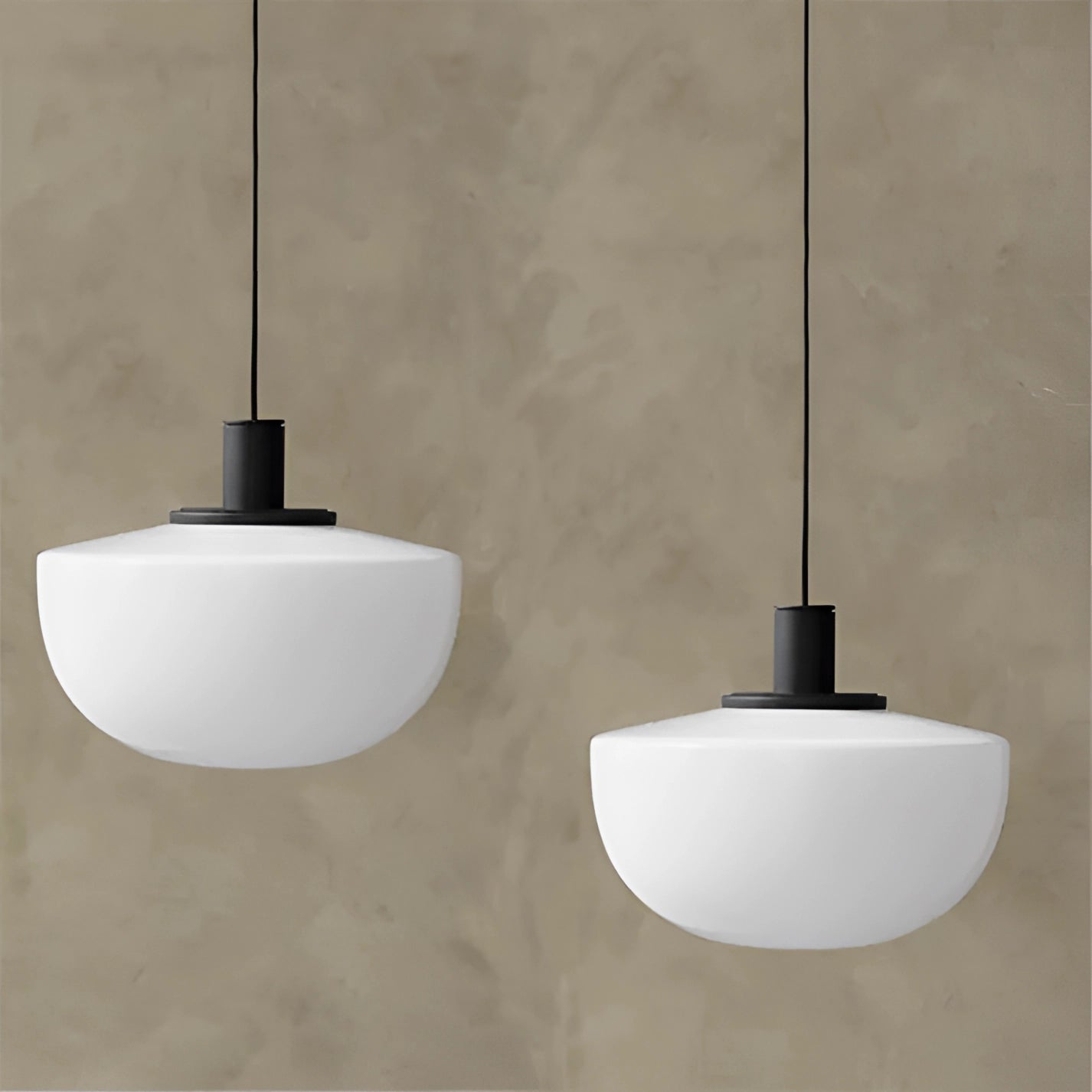 Minimalist pendant light with a modern Scandinavian design featuring wood and composite materials, hanging from the ceiling in a dining room setting.