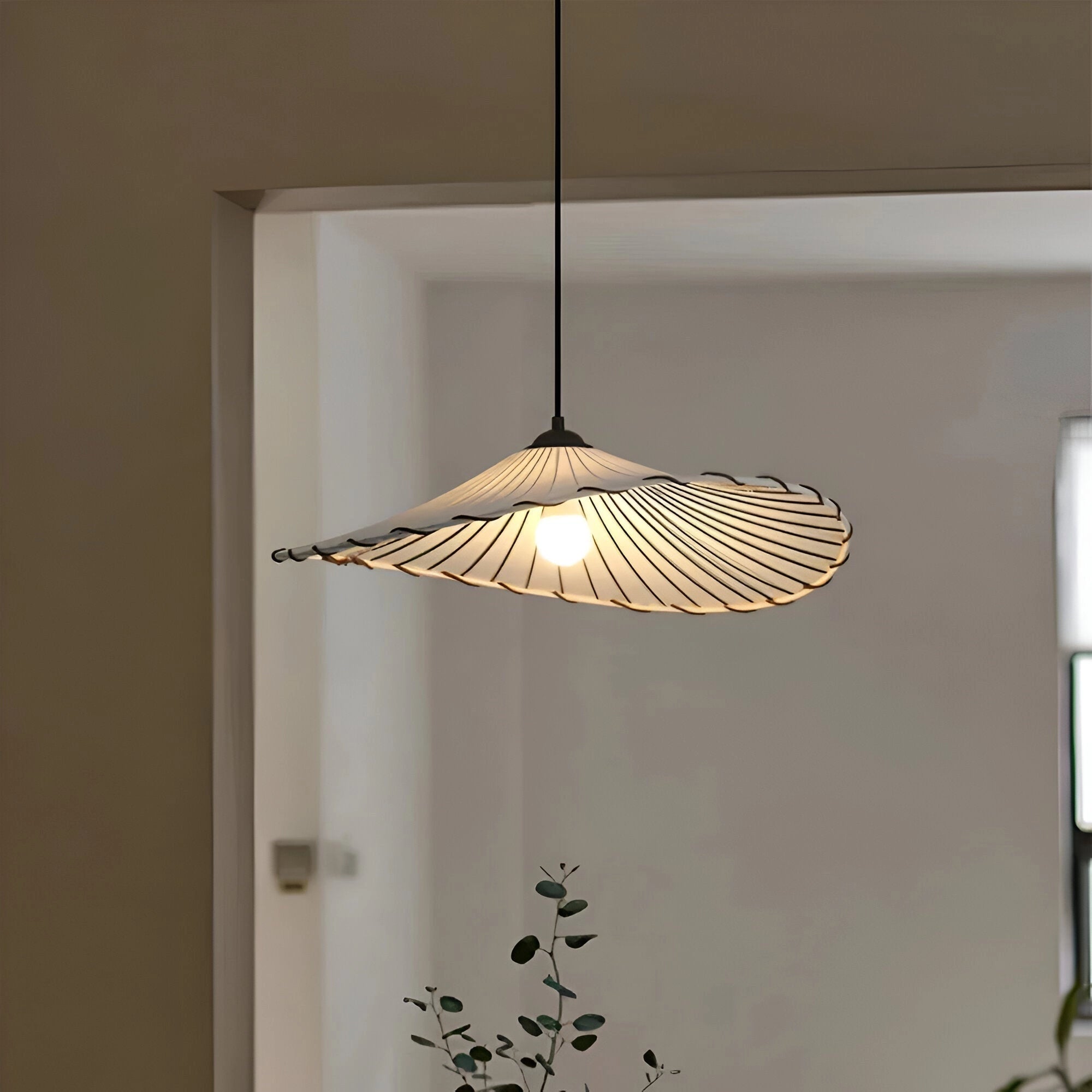 A minimalist Scandinavian pendant lamp featuring a wooden slat shade, measuring 51cm x 12cm, hanging in a modern interior space.