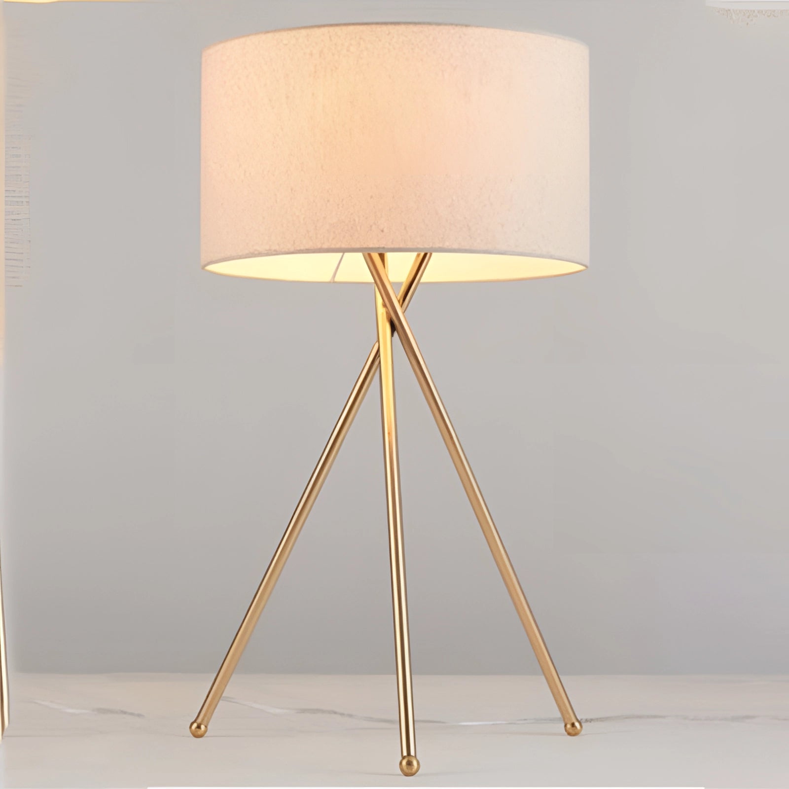 Minimalist Scandinavian tripod floor lamp with a wooden base and a modern rectangular lampshade, designed in a sleek and stylish fashion.