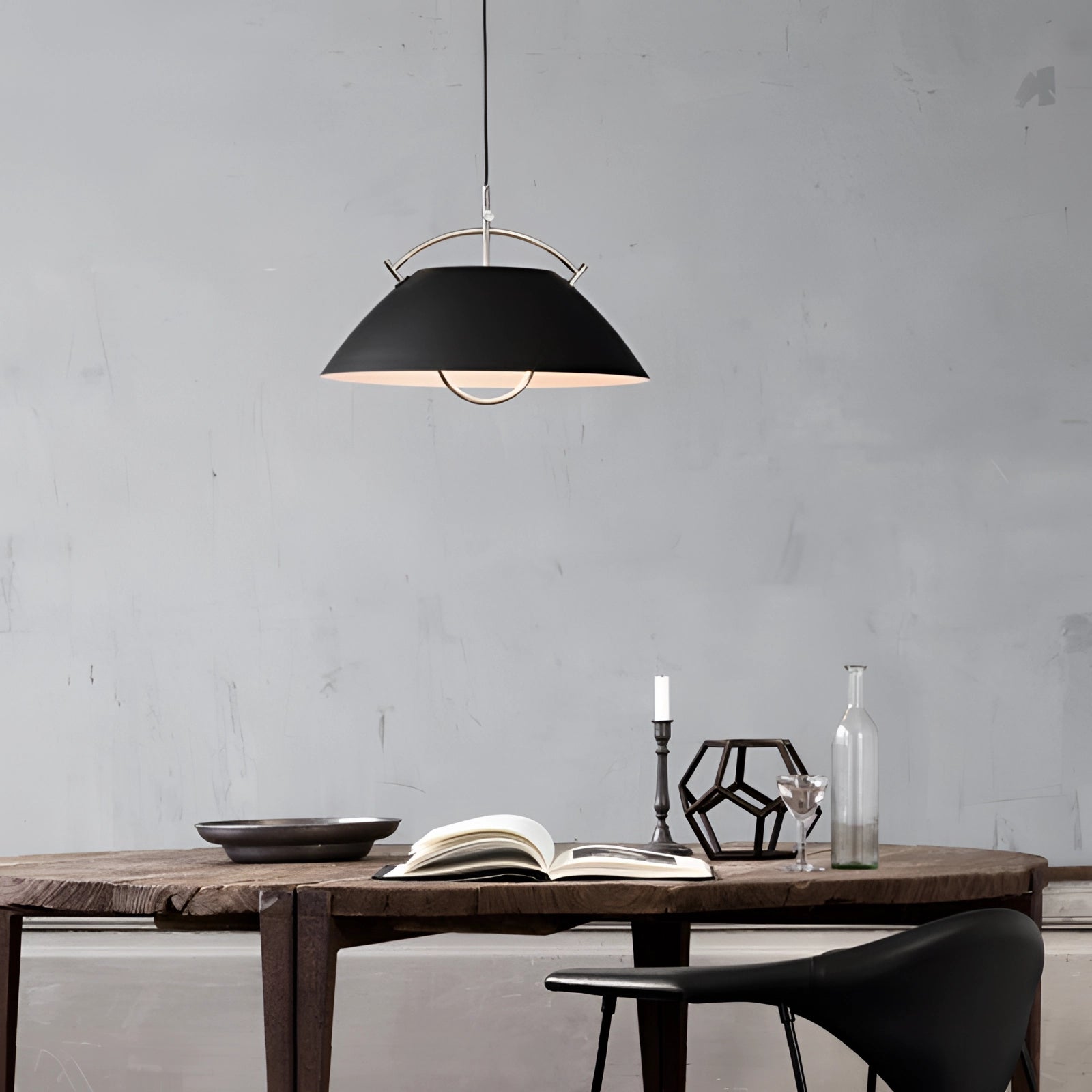 Minimalist Scandinavian white pendant light with a modern adjustable design, featuring a black shade with a diameter of 20.1 inches, elegantly hanging above a wooden table in a stylish interior setting.