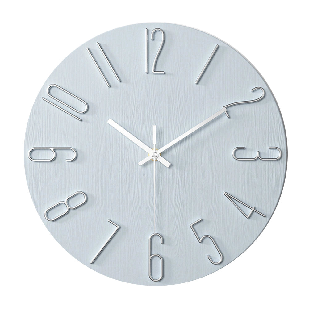 Minimalist soft pink Scandinavian wall clock with a modern design featuring a circular shape and quartz movement, suitable for interior decor.