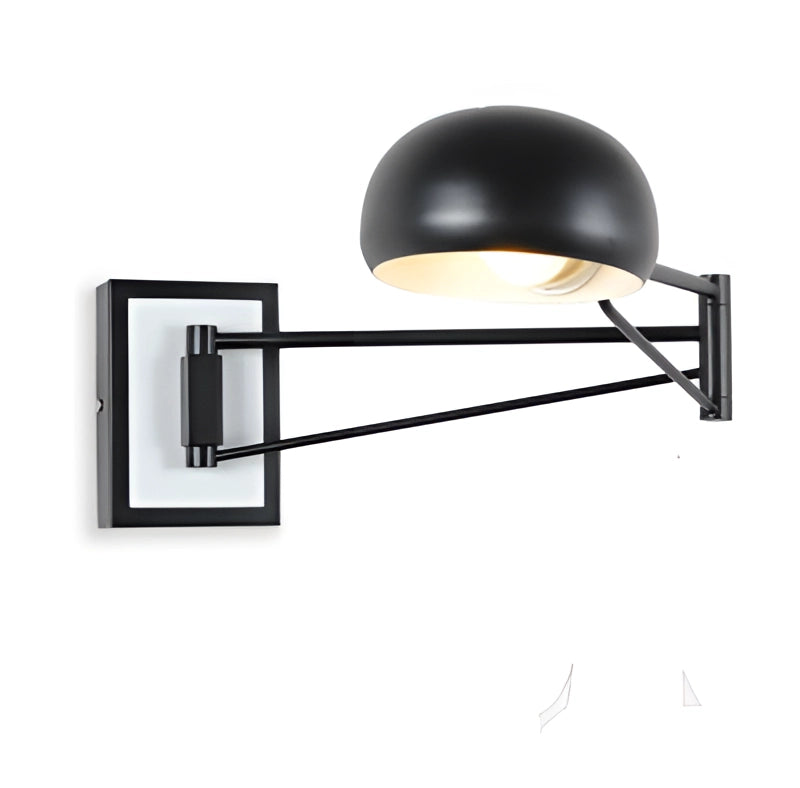 Mint green adjustable swing arm wall lamp with black cord plug mounted on a wooden wall, modern bedroom lighting.