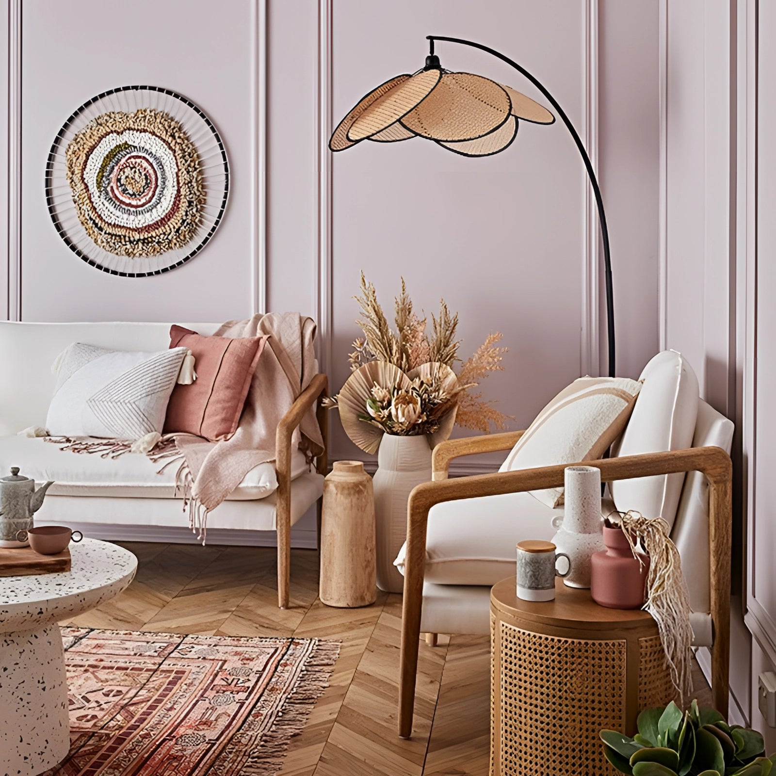 A modern adjustable arched floor lamp with a minimalist design placed next to a comfortable couch in a well-decorated living room featuring wooden flooring, indoor plants, and a small table.